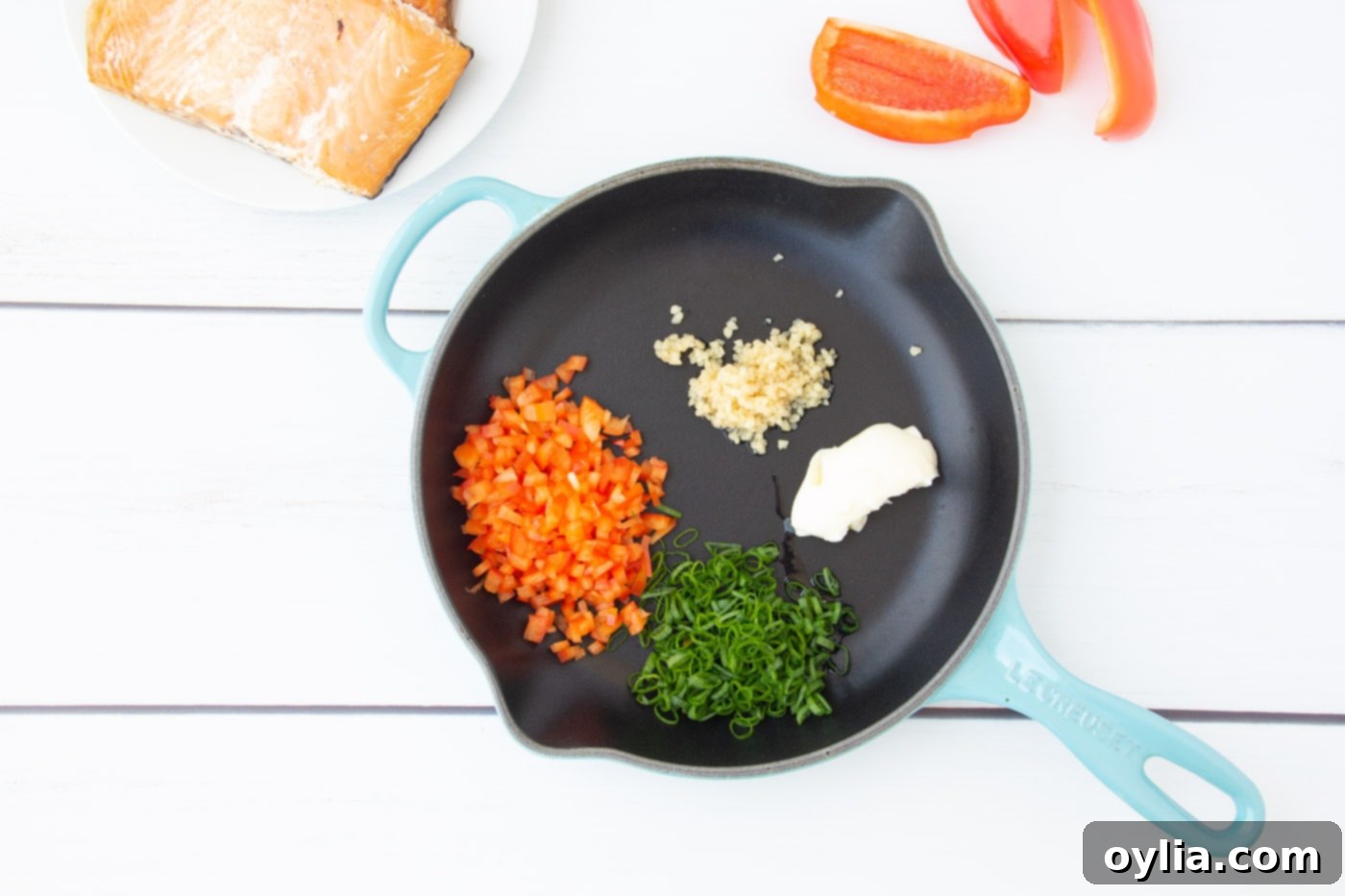 bell pepper, green onion, garlic, and butter in a skillet