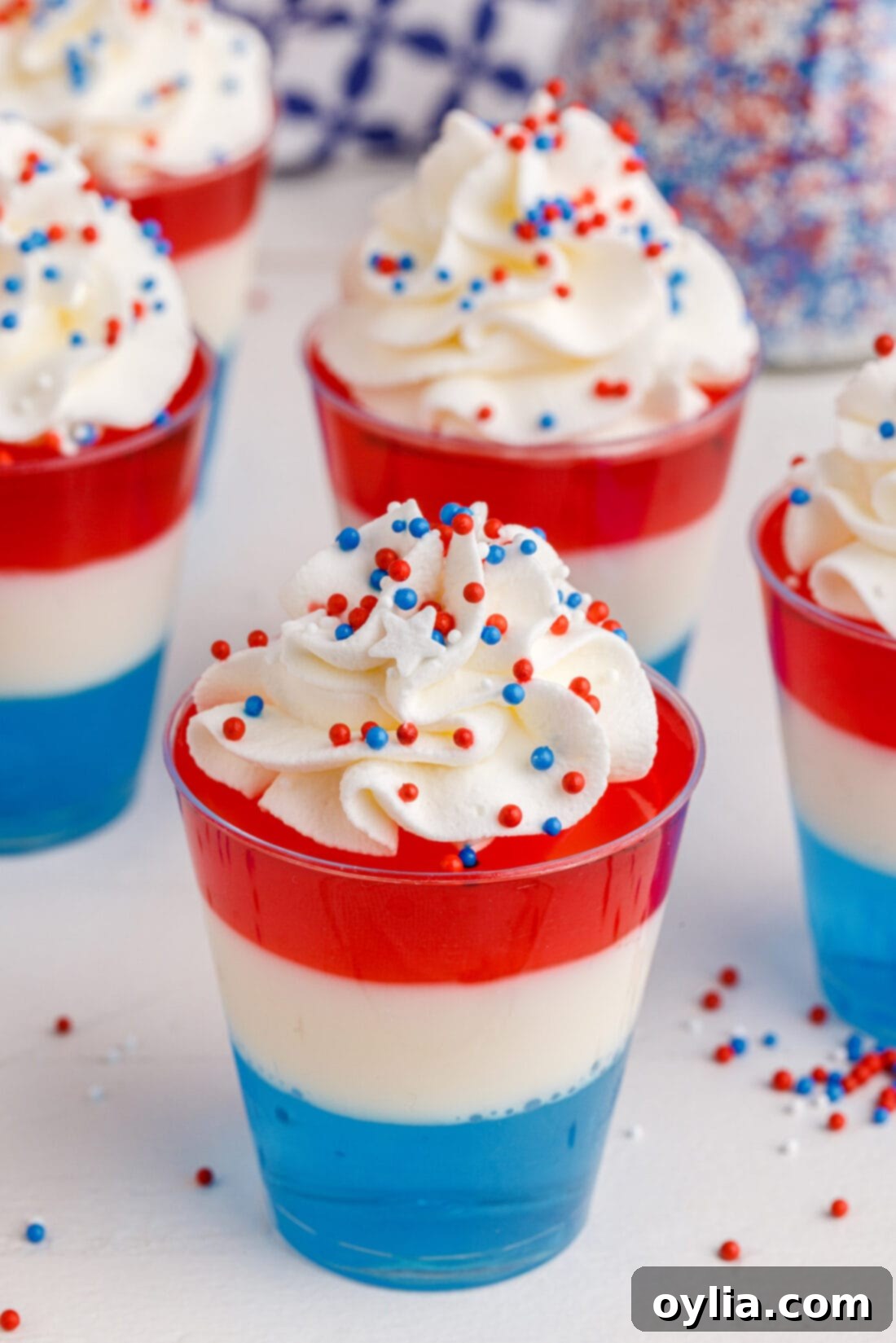 A tray full of vibrant red, white, and blue 4th of July Jello Shots, perfect for a patriotic celebration