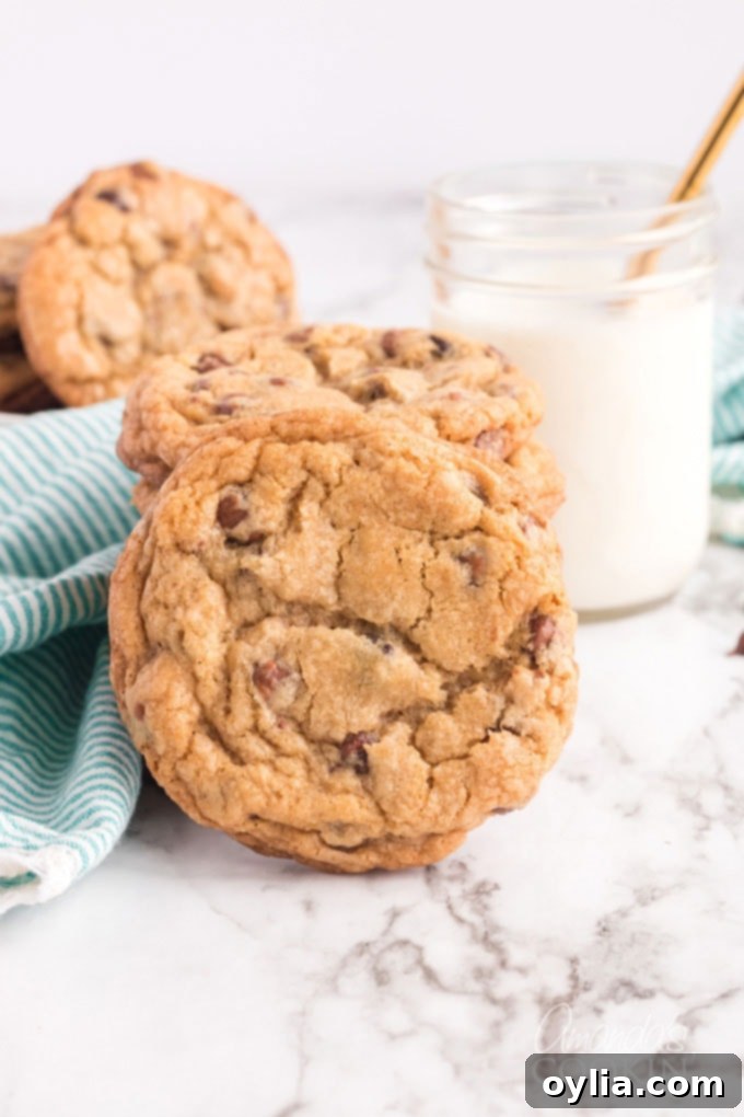 Big Soft Chocolate Chip Cookies AmandasCookin.com Delicious jumbo chocolate chip cookies paired with a refreshing glass of milk