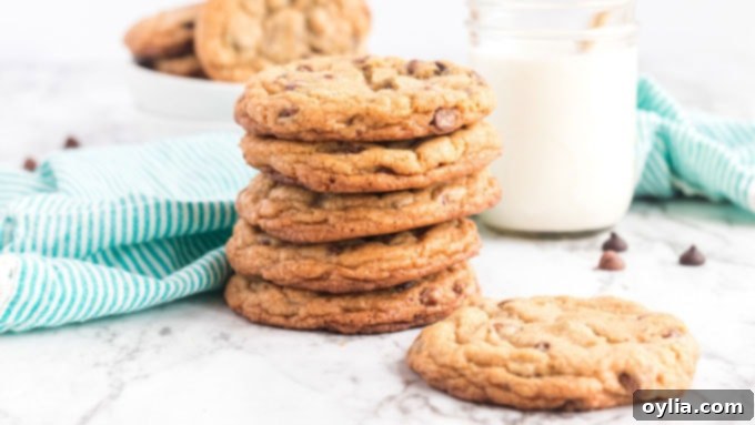 Big Soft Chocolate Chip Cookies AmandasCookin.com Close-up of a stack of perfect jumbo chocolate chip cookies with melted chocolate chips