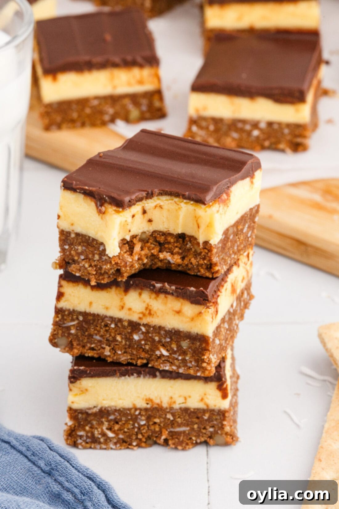 stack of Nanaimo Bars with a bite out of it