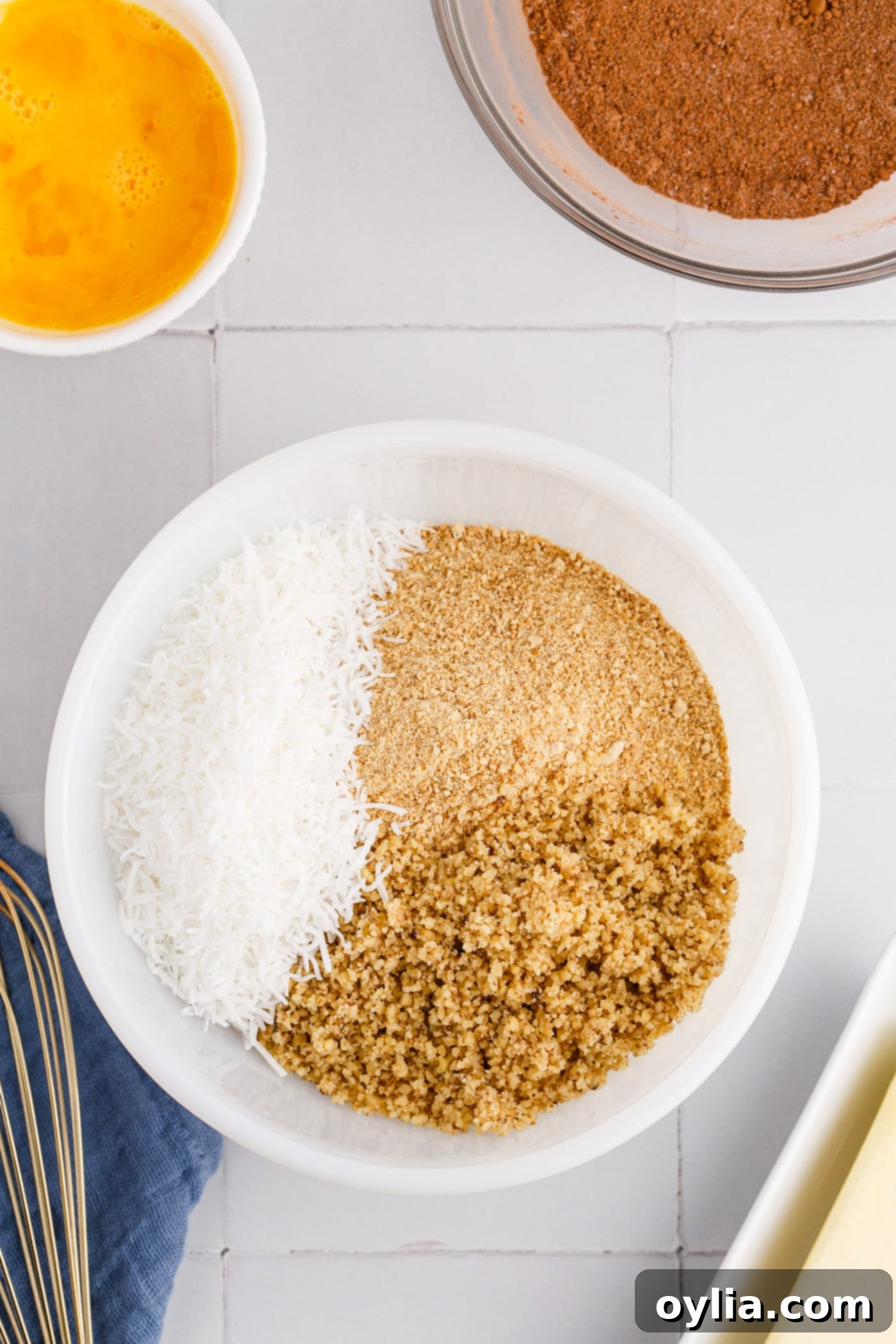 coconut, graham, and walnuts in a bowl