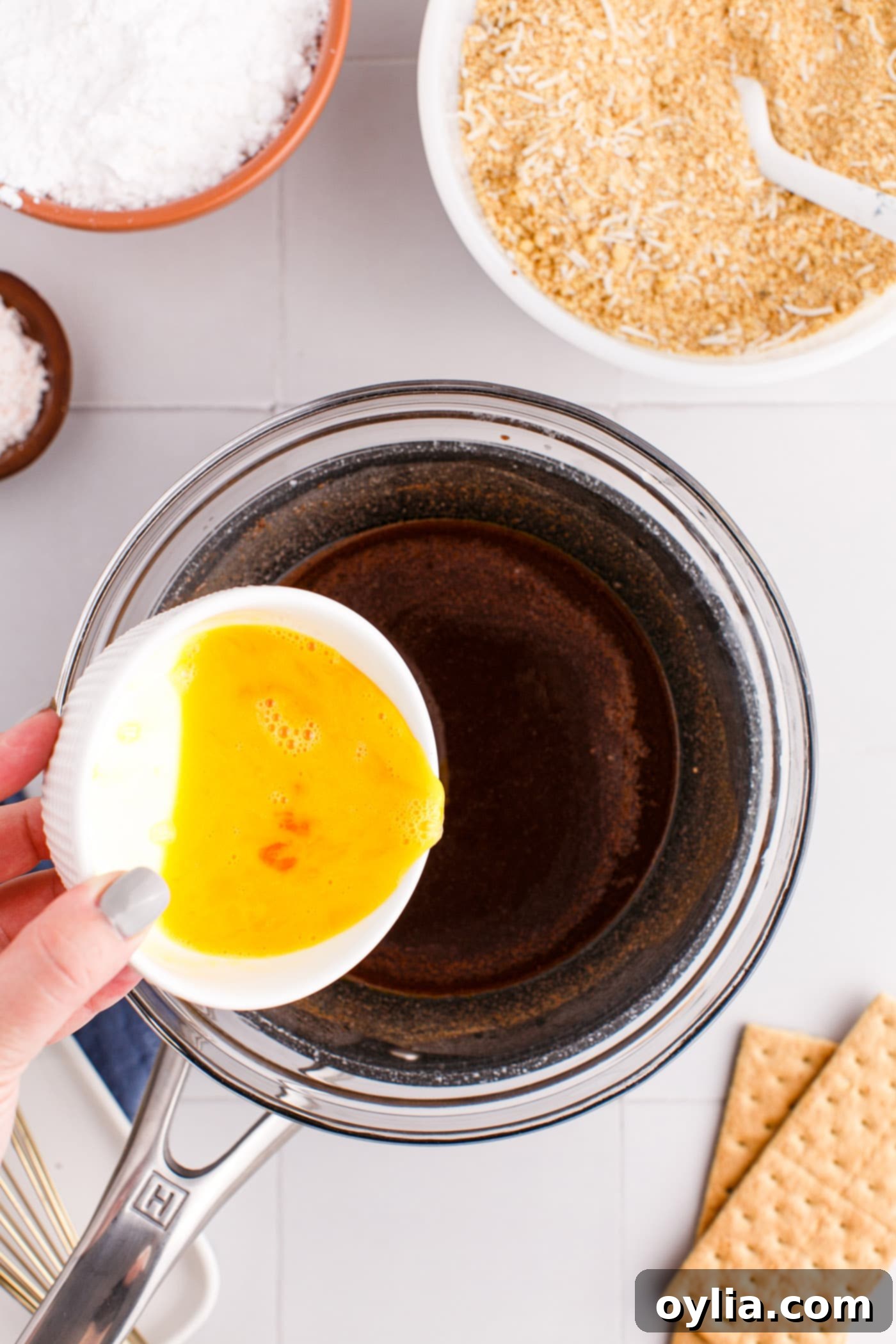 adding egg to melted cocoa and butter mixture
