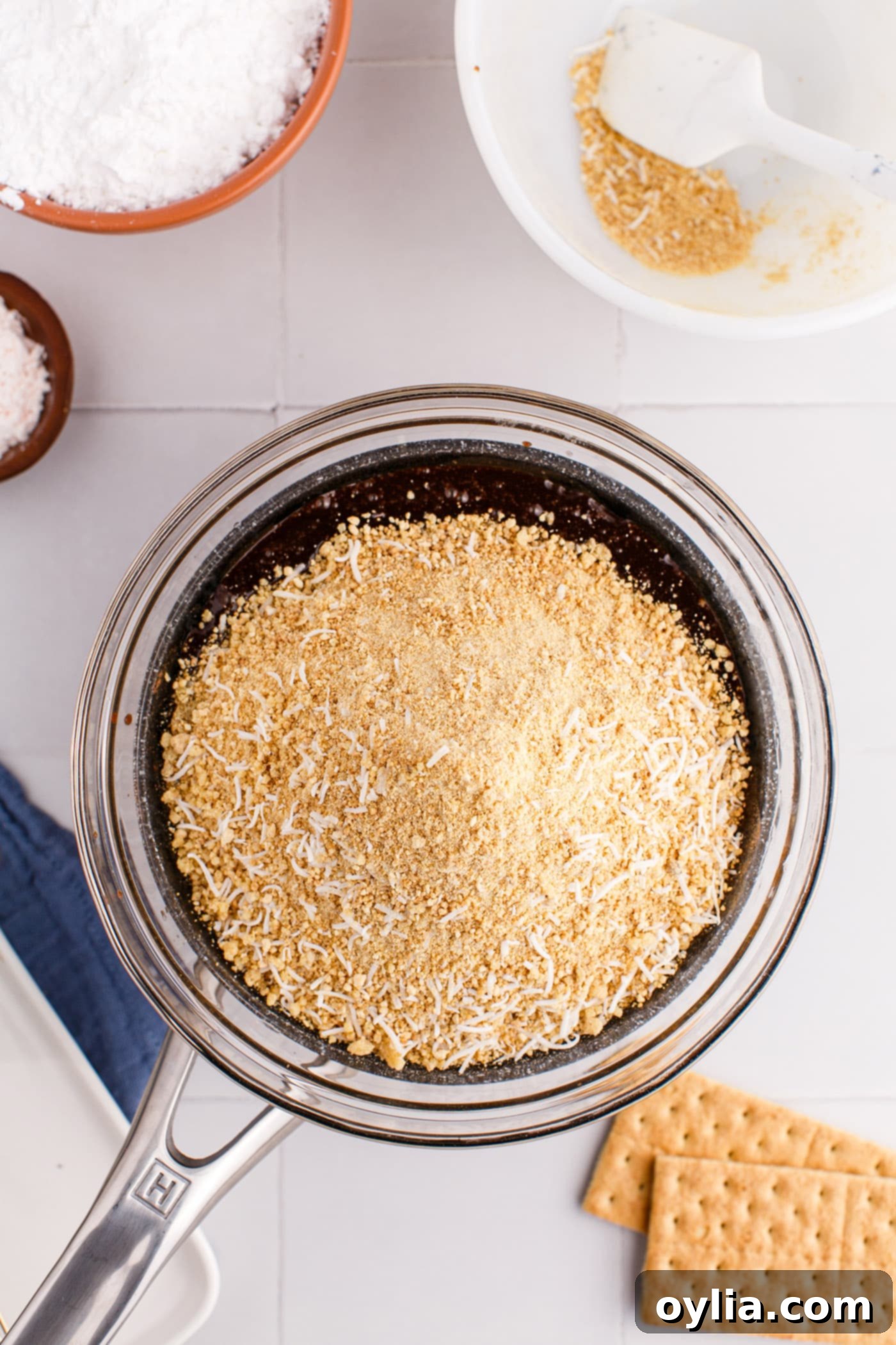 crumb and coconut mixture added to bowl