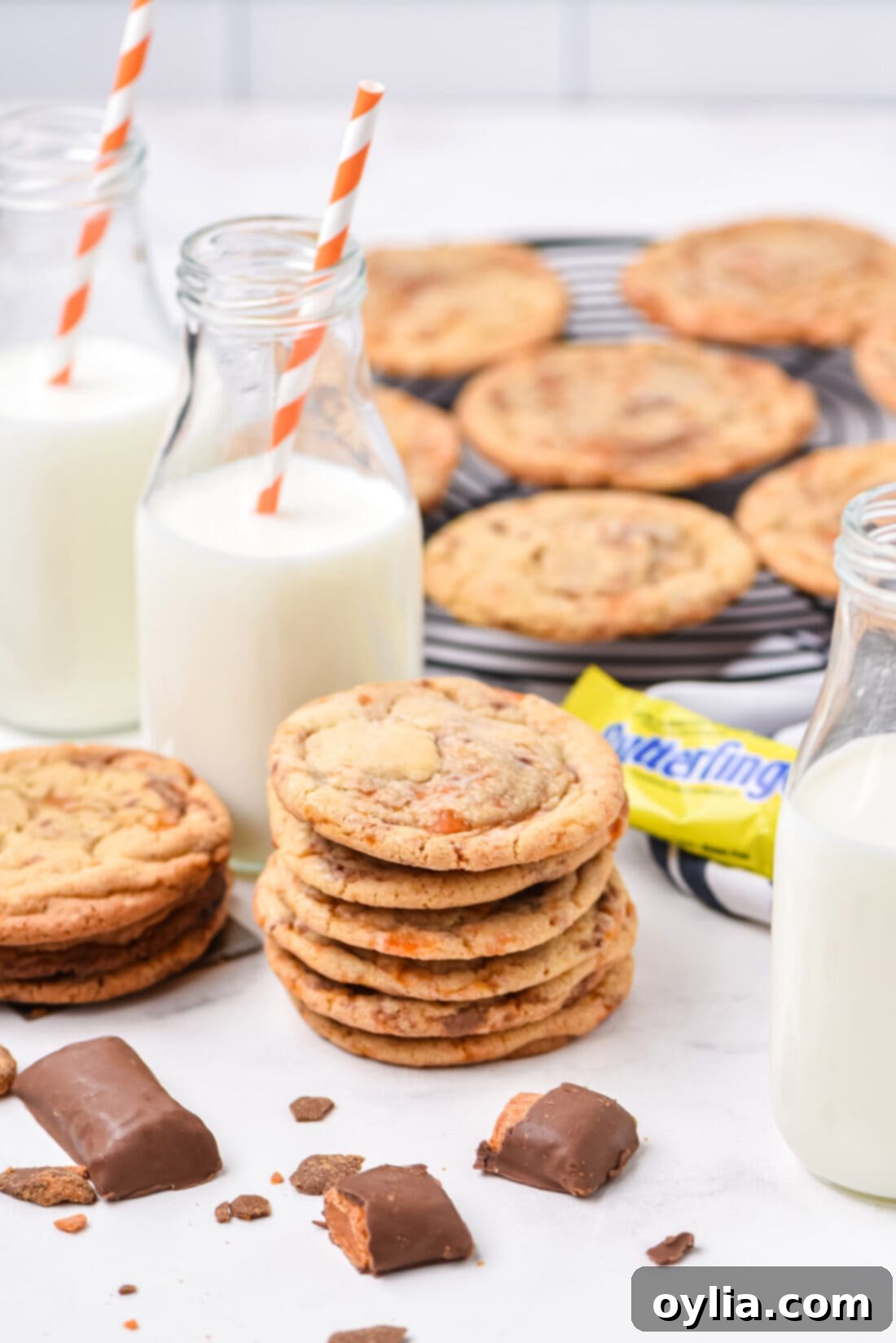 stack of Butterfinger Cookies with milk
