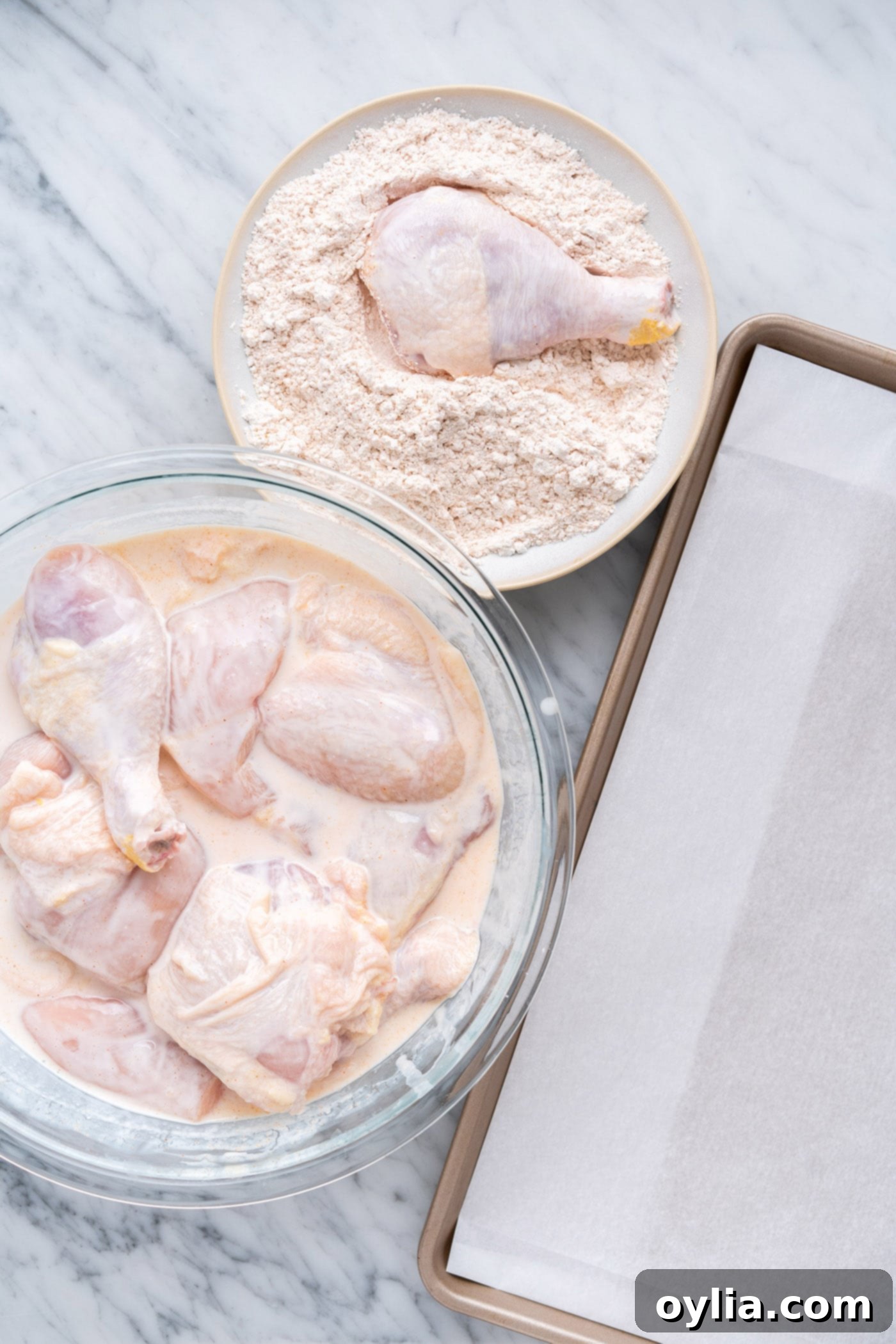 dredging chicken in seasoned flour