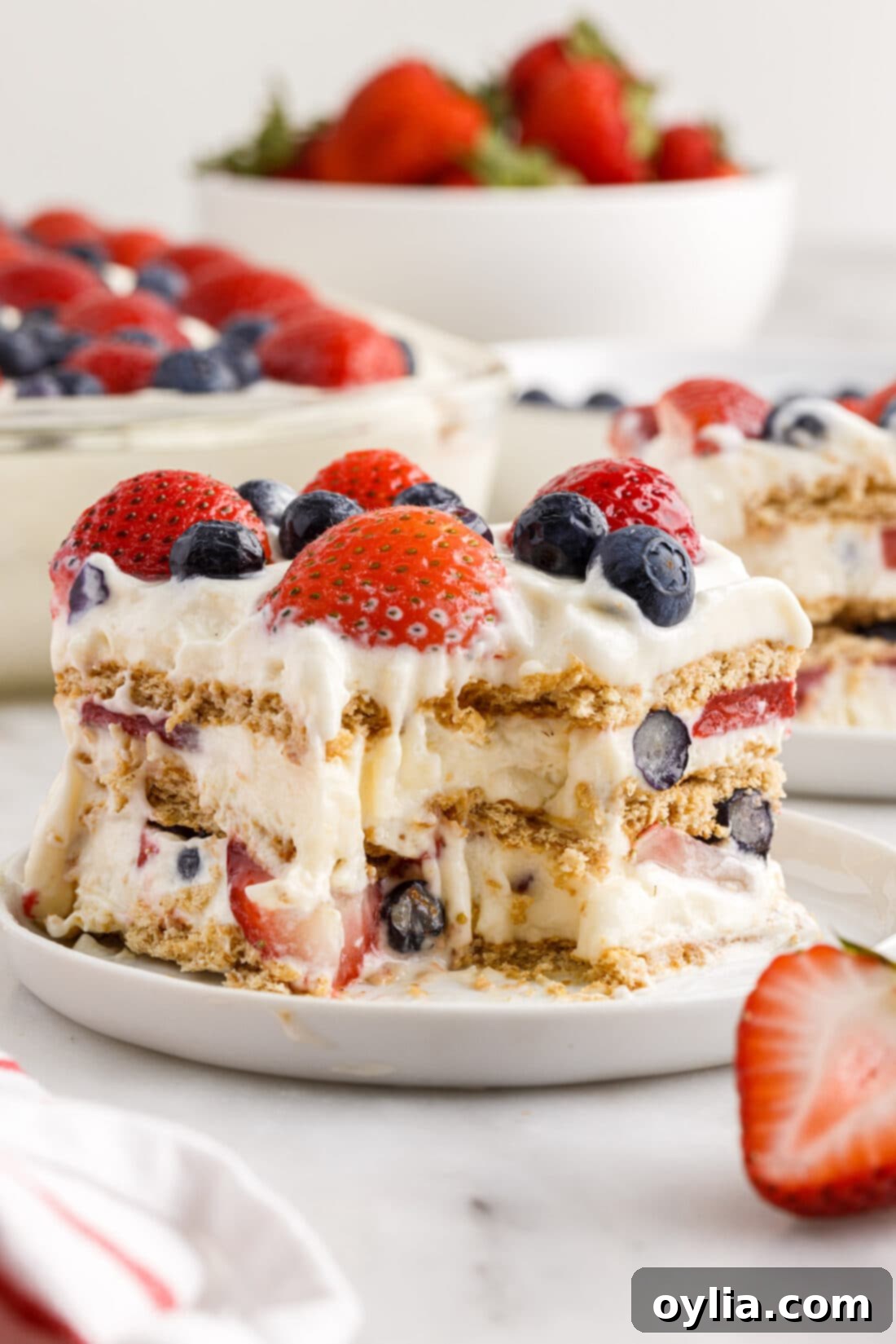 slice of Mixed Berry Icebox Cake with a bite out of it