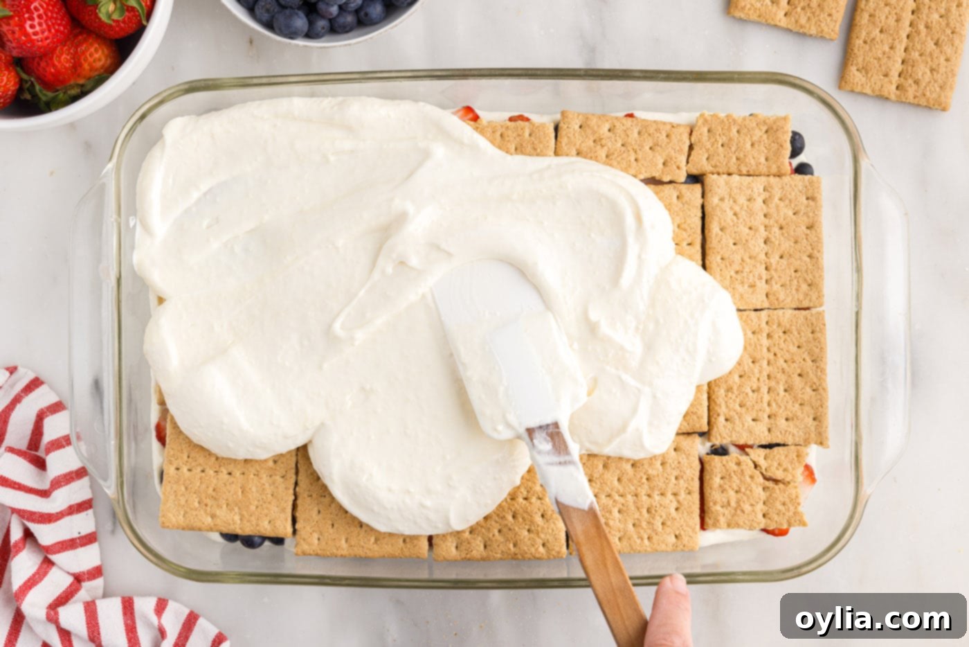 spreading cream cheese mixture over graham crackers