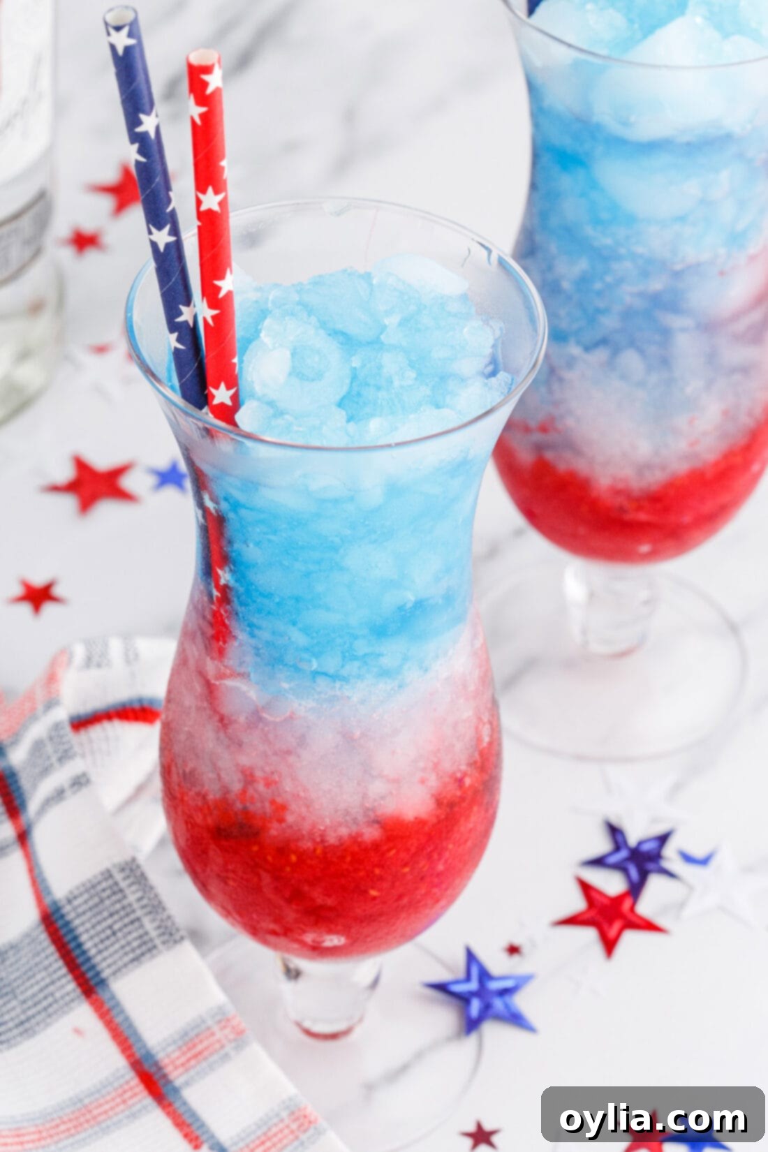 Finished Patriotic Vodka Lemonade Slushie with festive straws and decorations for a party