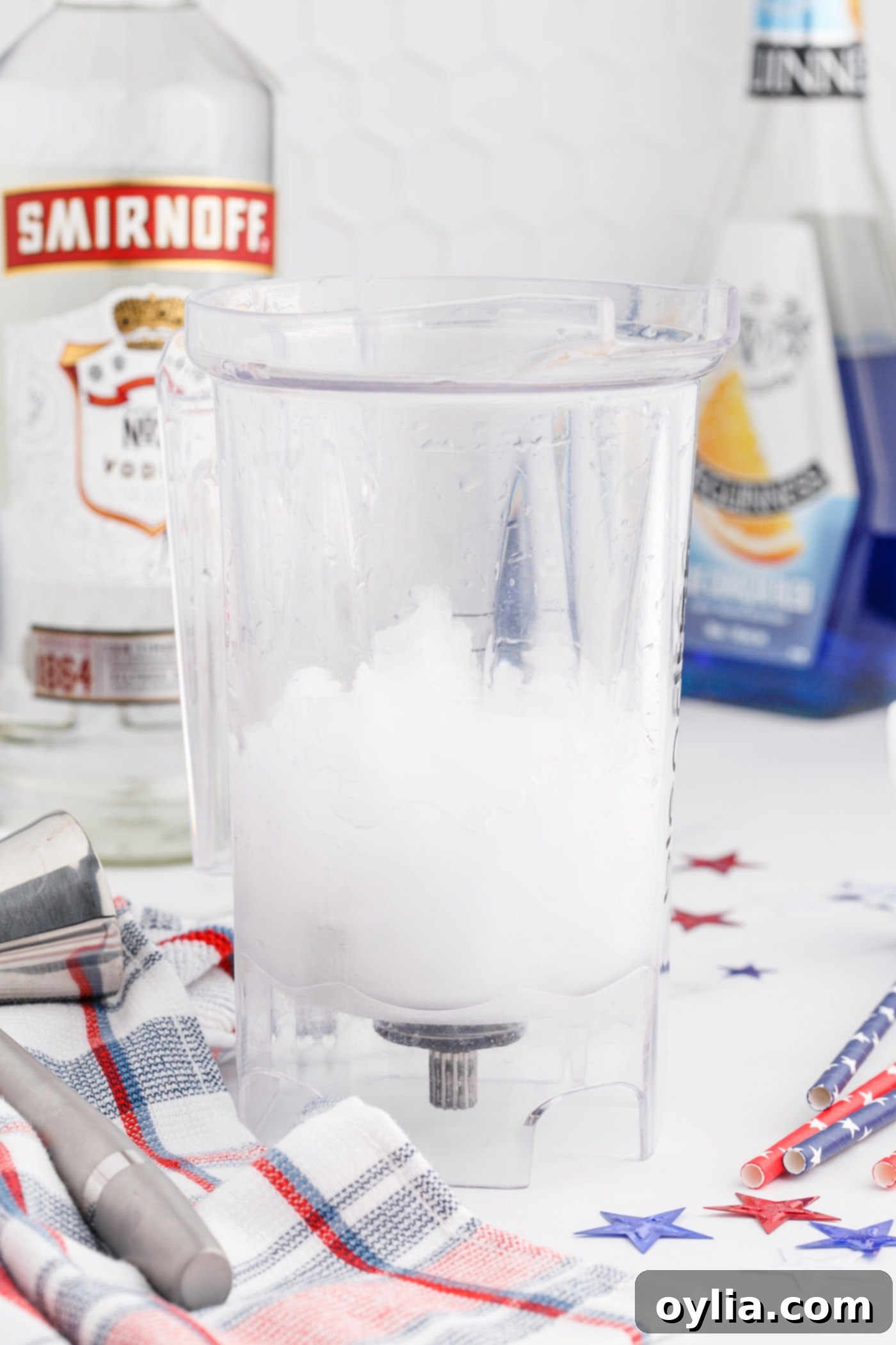 Vodka lemonade slush being blended for the white layer