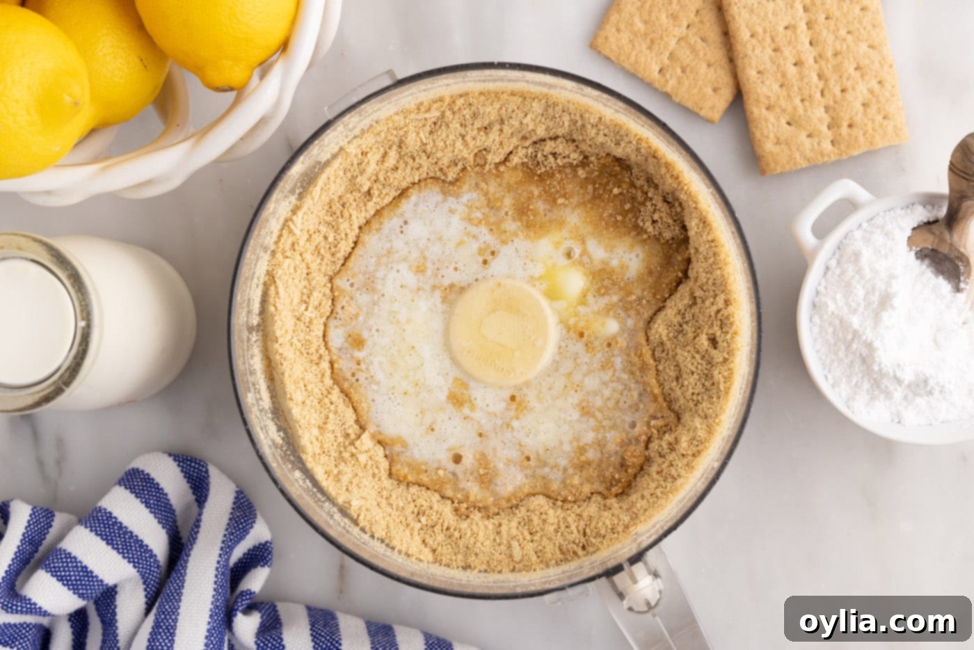 graham cracker crumbs and melted butter in a food processor