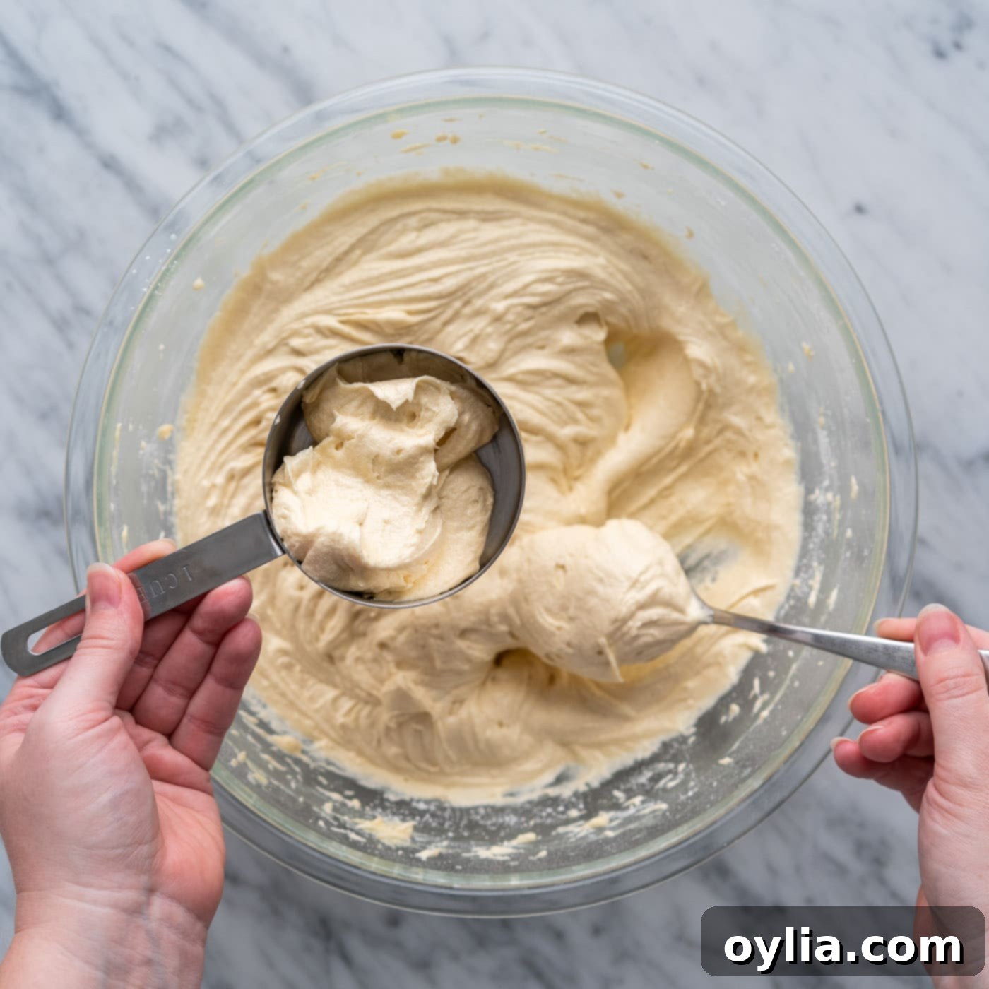 One cup of yellow cake batter scooped into a separate bowl, ready for chocolate