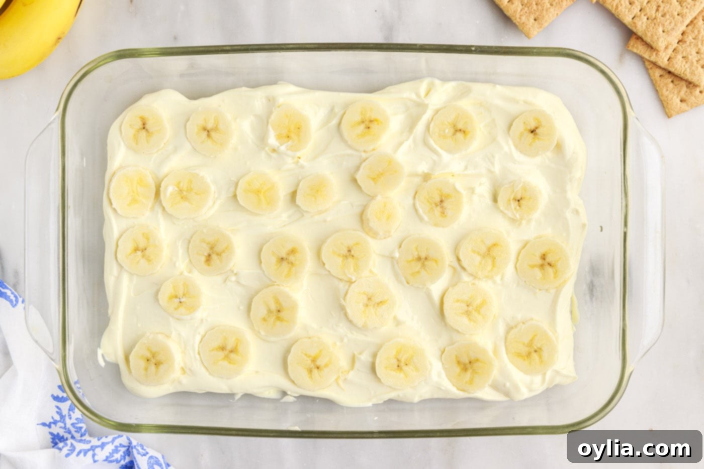 banana slices on top of banana cream pudding