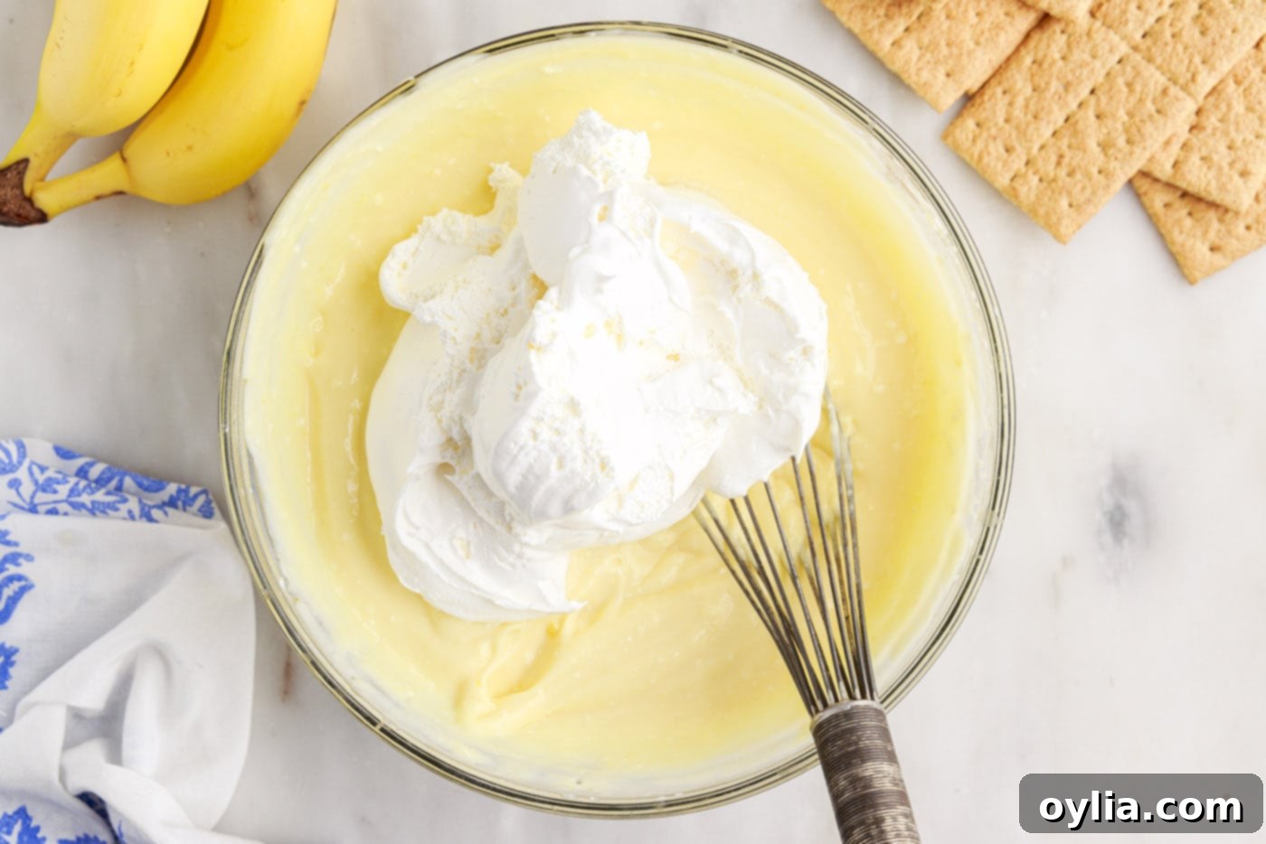 folding cool whip into banana cream pudding mixture
