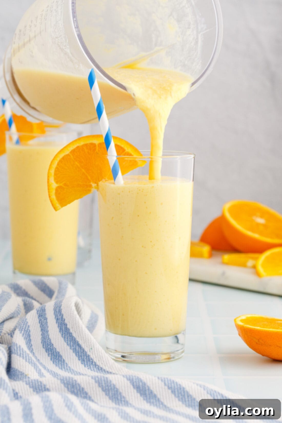 Orange Julius 2 pouring an Orange Julius from a blender