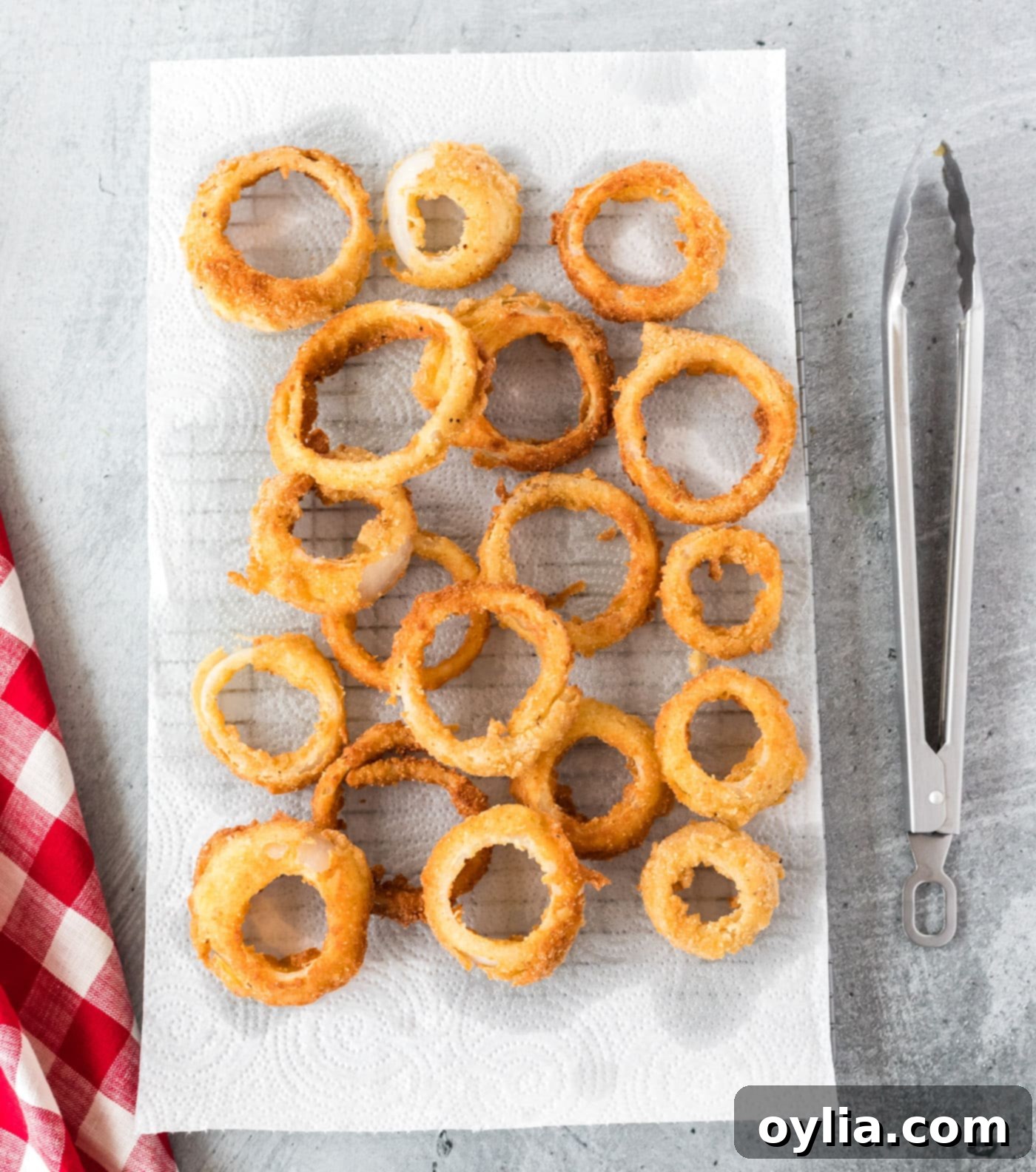 fried onion rings on a paper towel