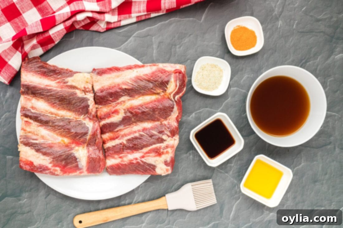 Tender Instant Pot Beef Ribs 4 A collection of ingredients laid out for Instant Pot Beef Ribs, including beef riblets, spices, and liquids.