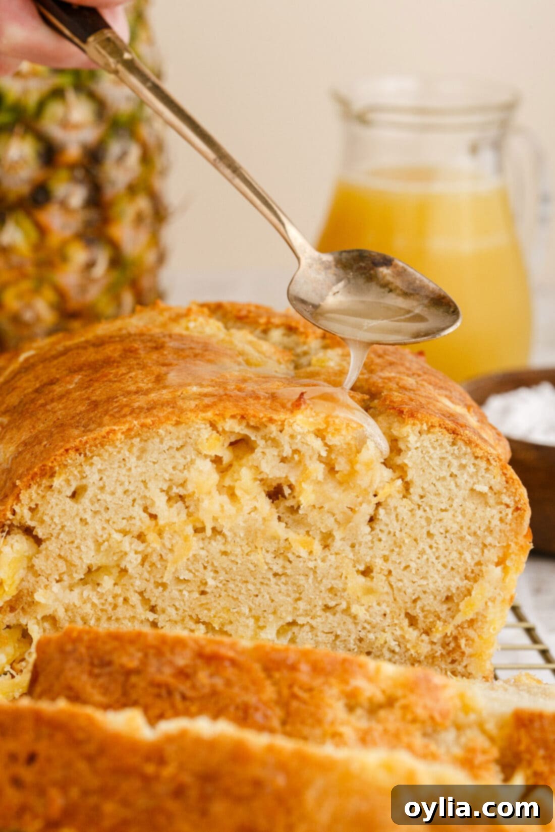 drizzling sauce on Pineapple Quick Bread