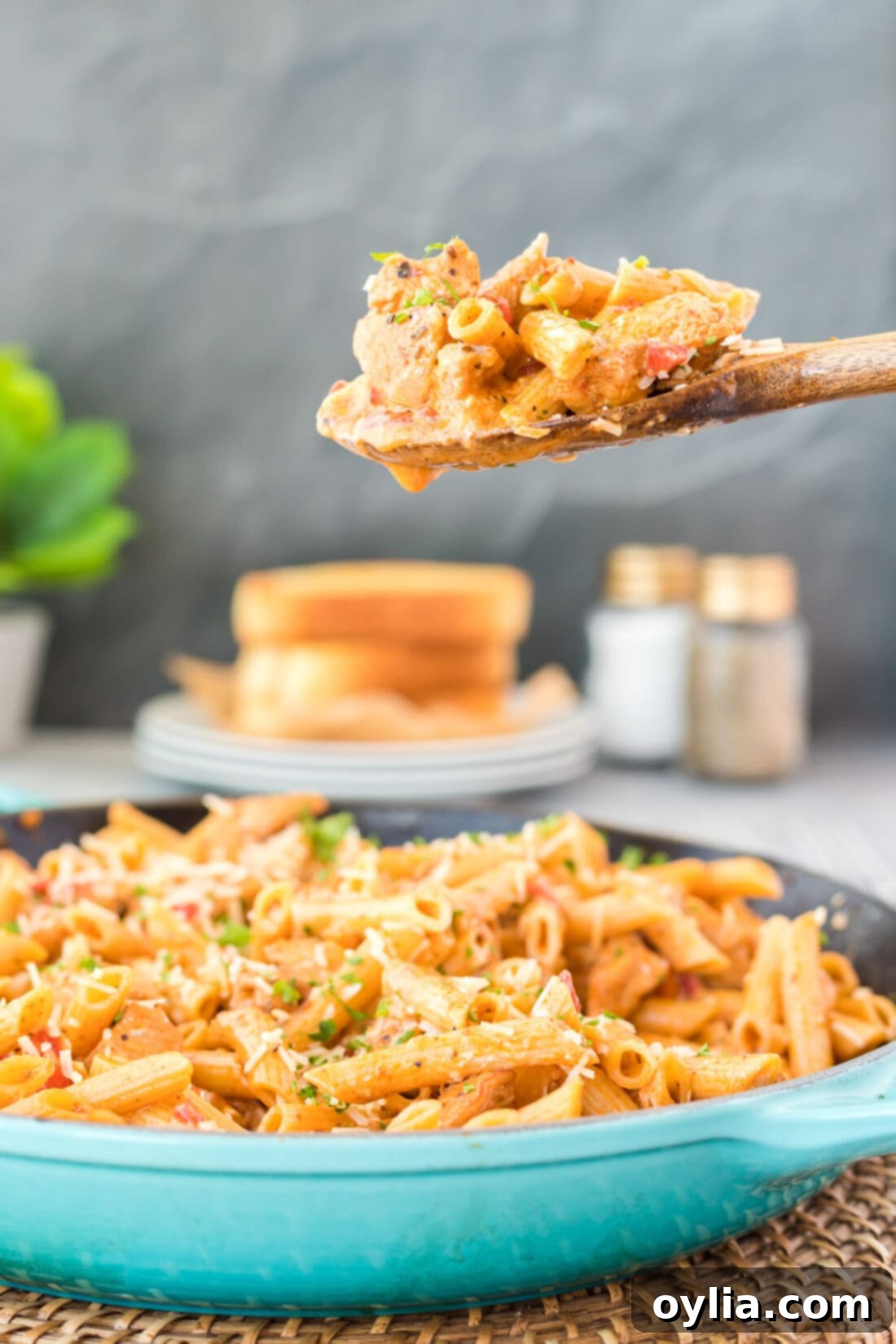 wooden spoon serving some Cajun Chicken Pasta