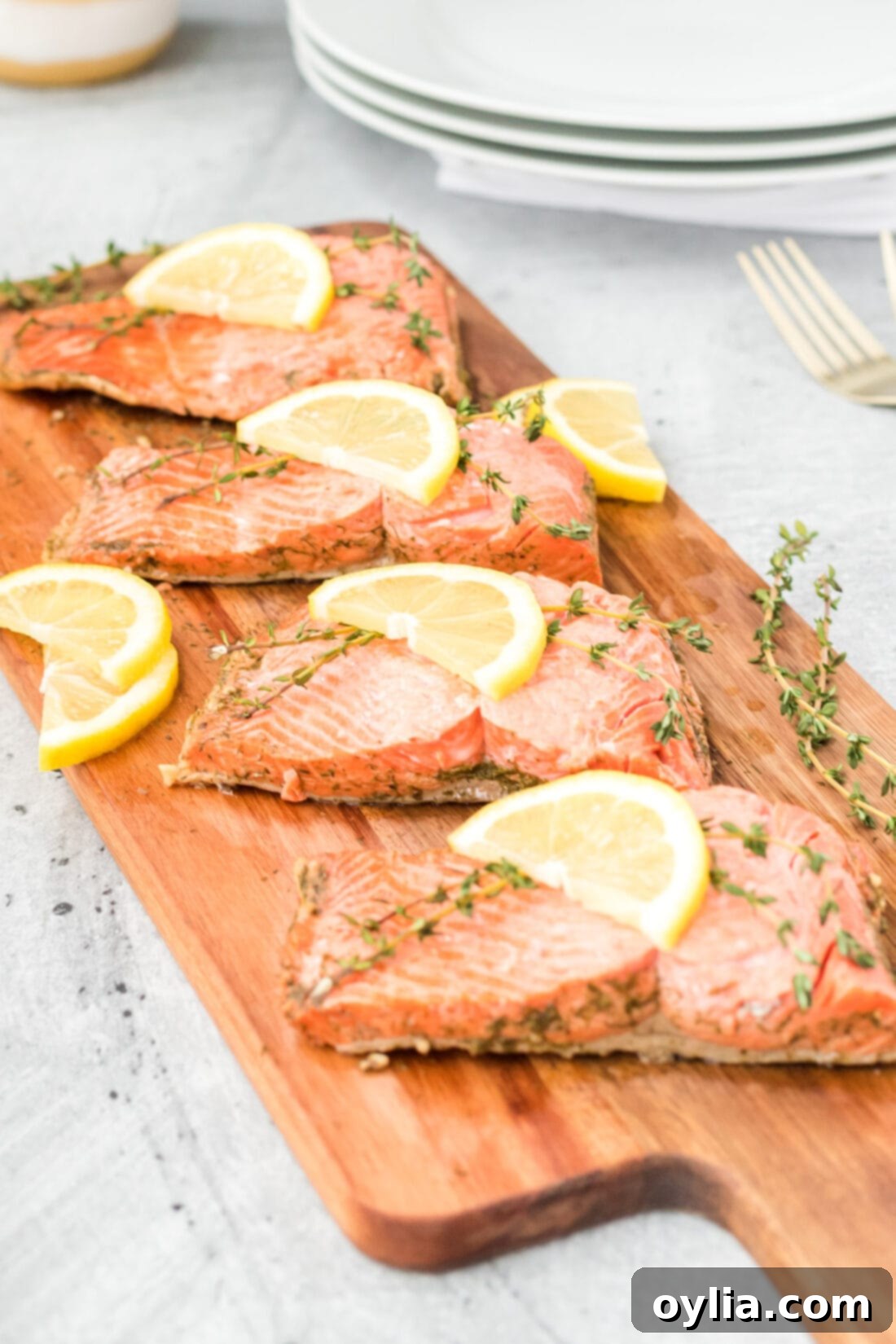 Silky Poached Salmon 6 4 filets of Poached Salmon on a wooden board, ready to be served