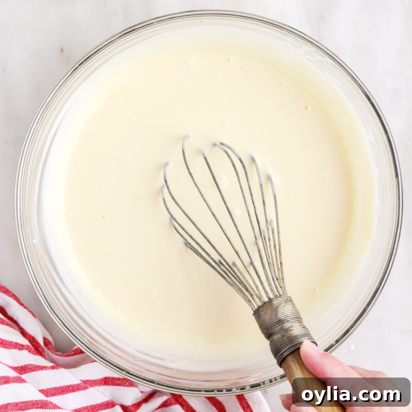 ingredients for rolled ice cream whisked in a bowl