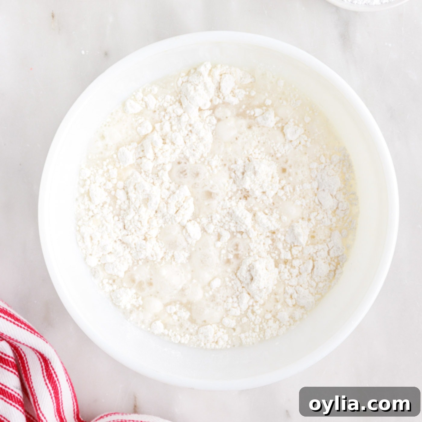 Pancake mix being whisked in a bowl for the Oreo batter.