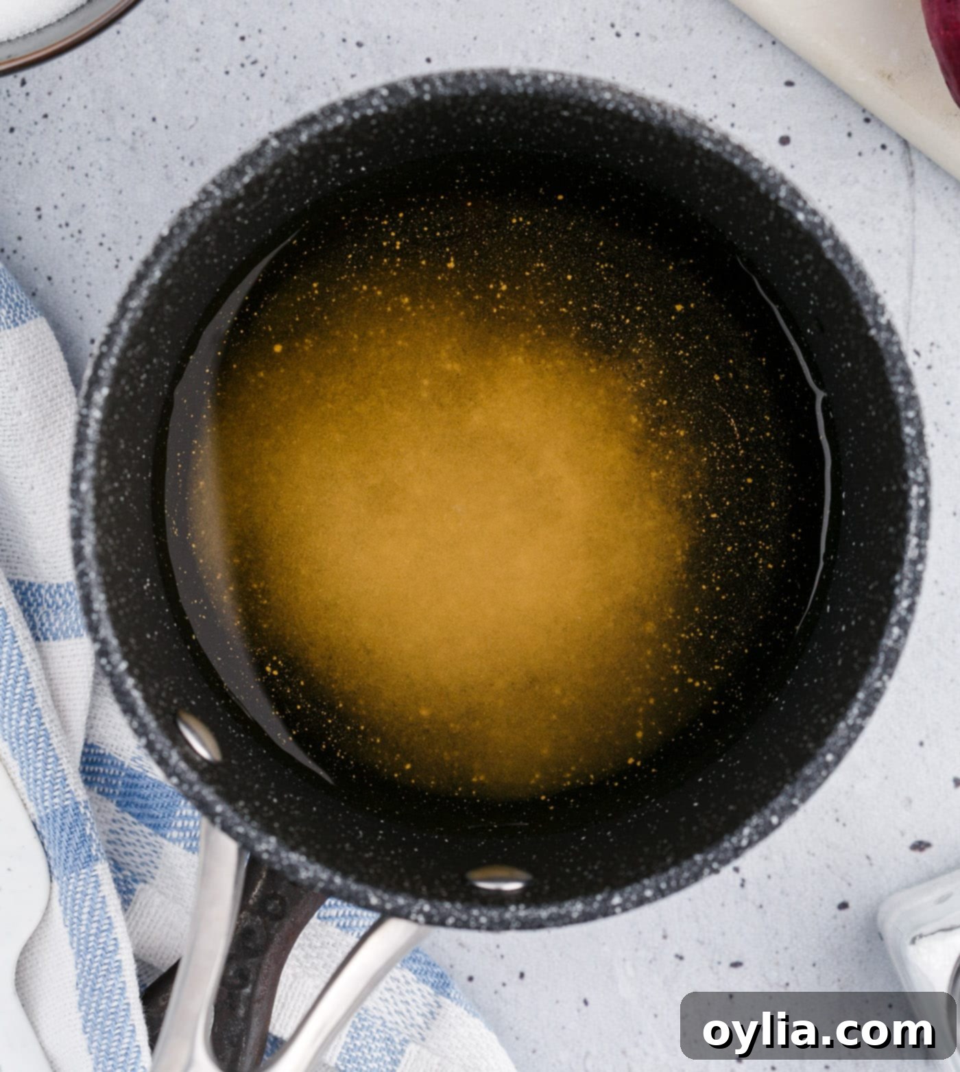 Vinegar mixture simmering in a saucepan on the stove