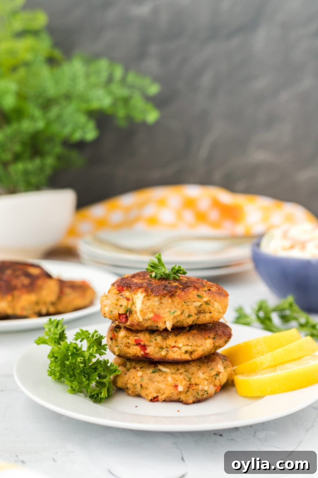 Stack of freshly fried golden-brown crab cakes, ready to serve