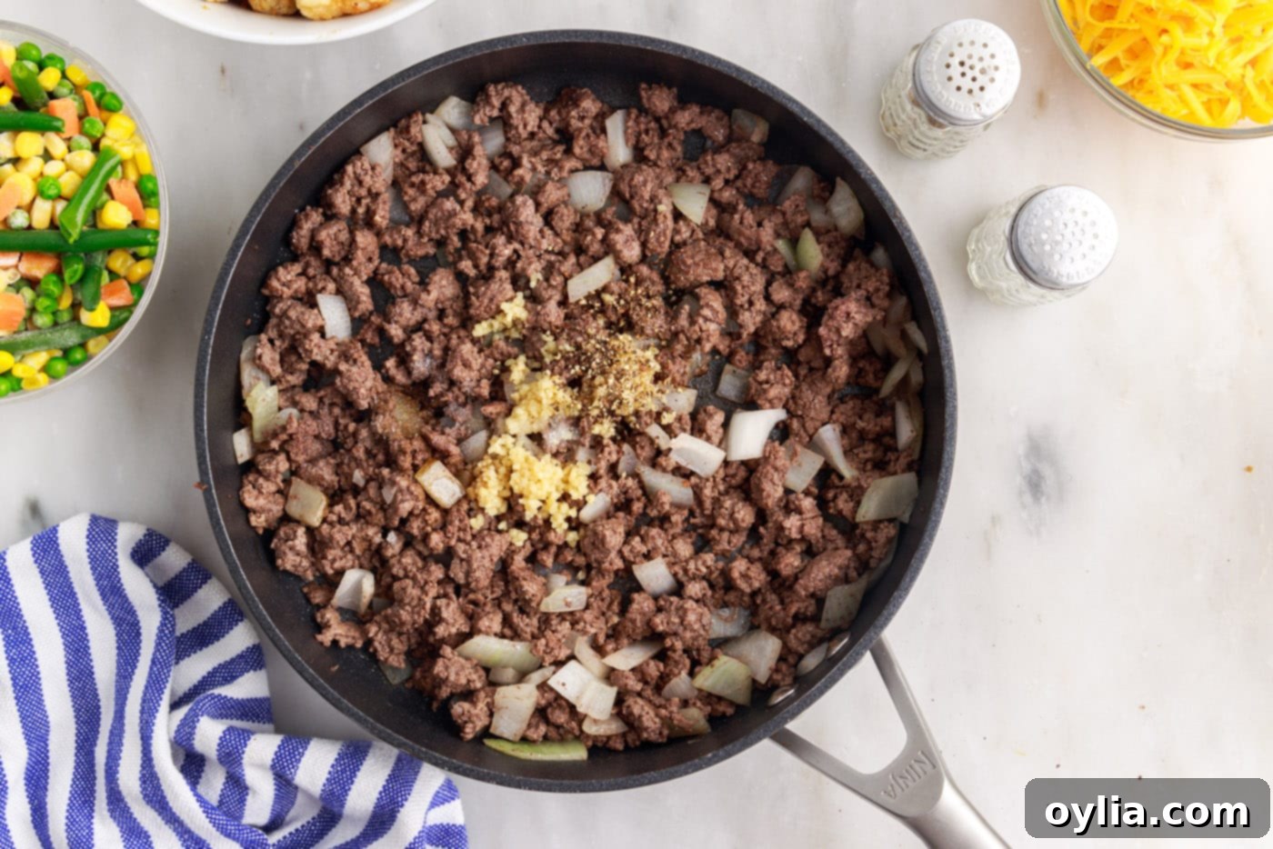 tatertot casserole beef and garlic in a skillet