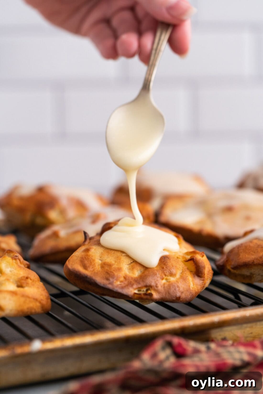 adding glaze to Air Fryer Apple Fritters