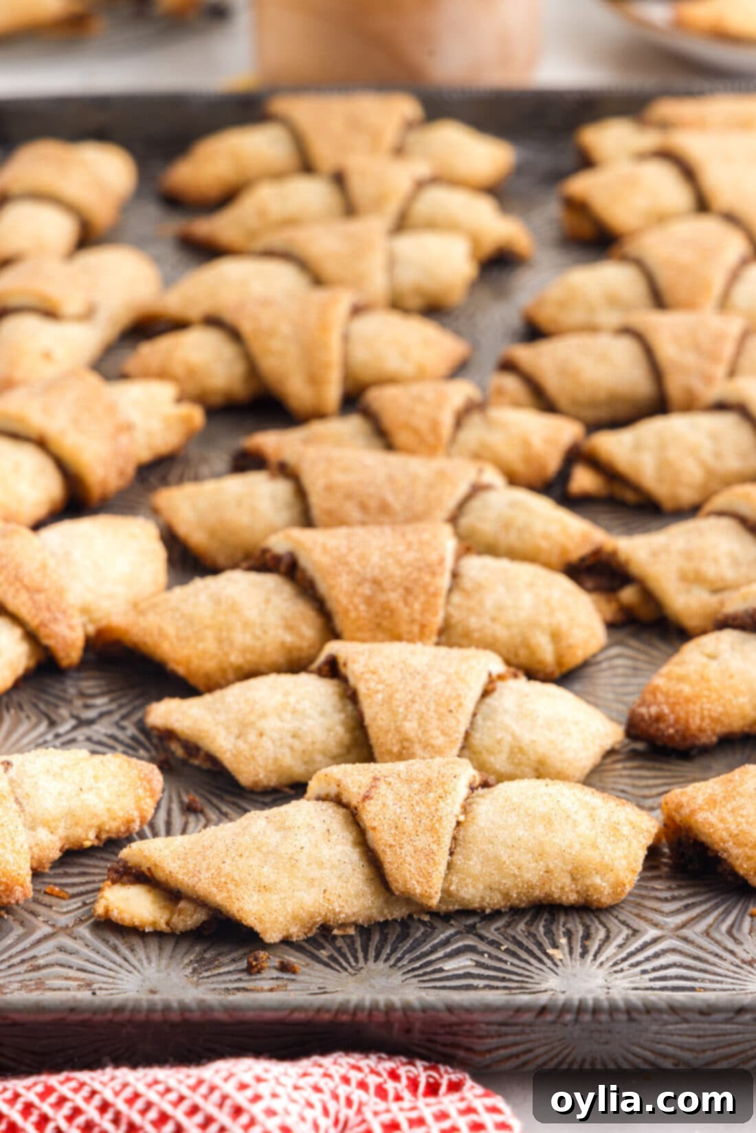 A baking pan filled with golden-brown Rugelach, fresh from the oven, ready to be enjoyed.