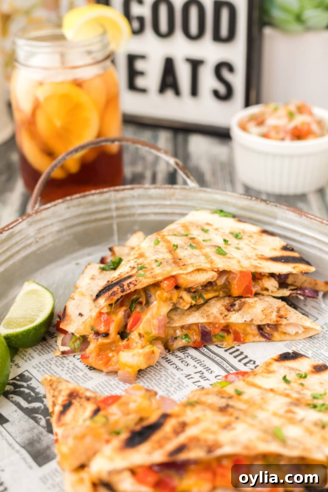 Ultimate Grilled Chicken Quesadilla 2 Platter of perfectly grilled chicken quesadilla triangles, golden and crispy