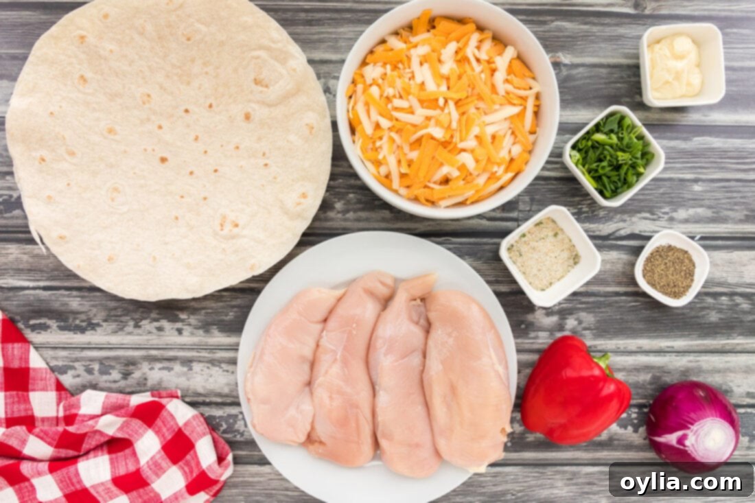 Ultimate Grilled Chicken Quesadilla 4 Bowls of prepped ingredients for grilled chicken quesadillas including seasoned chicken, mixed cheeses, chopped bell peppers, and onions