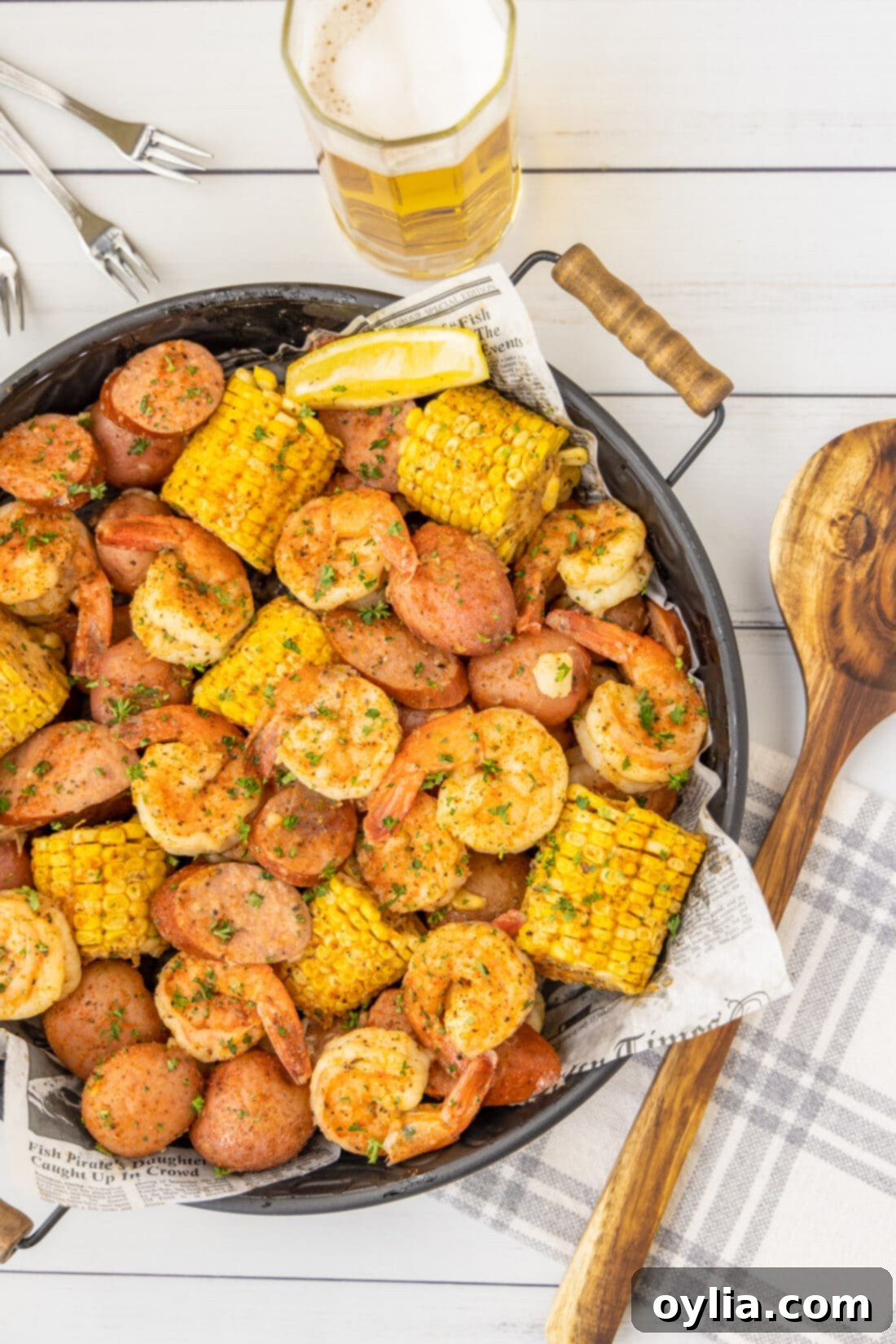 Shrimp Boil with beer and a spoon