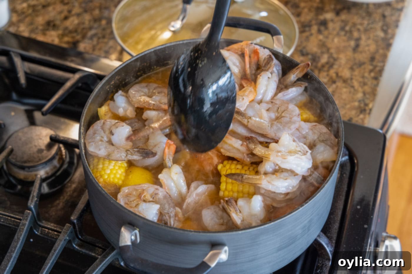 stirring shrimp boil