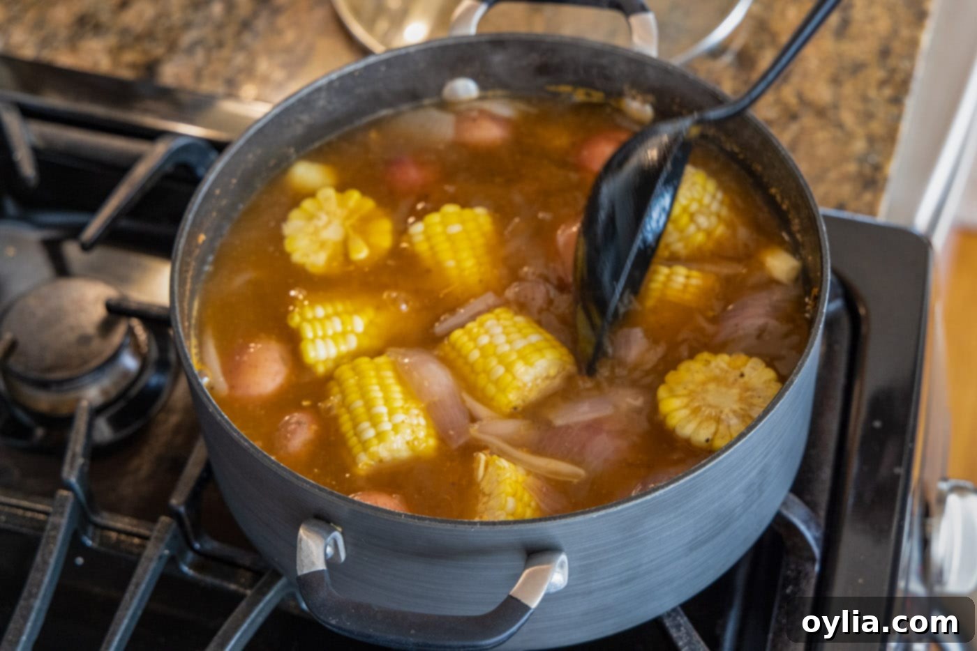 stirring shrimp boil