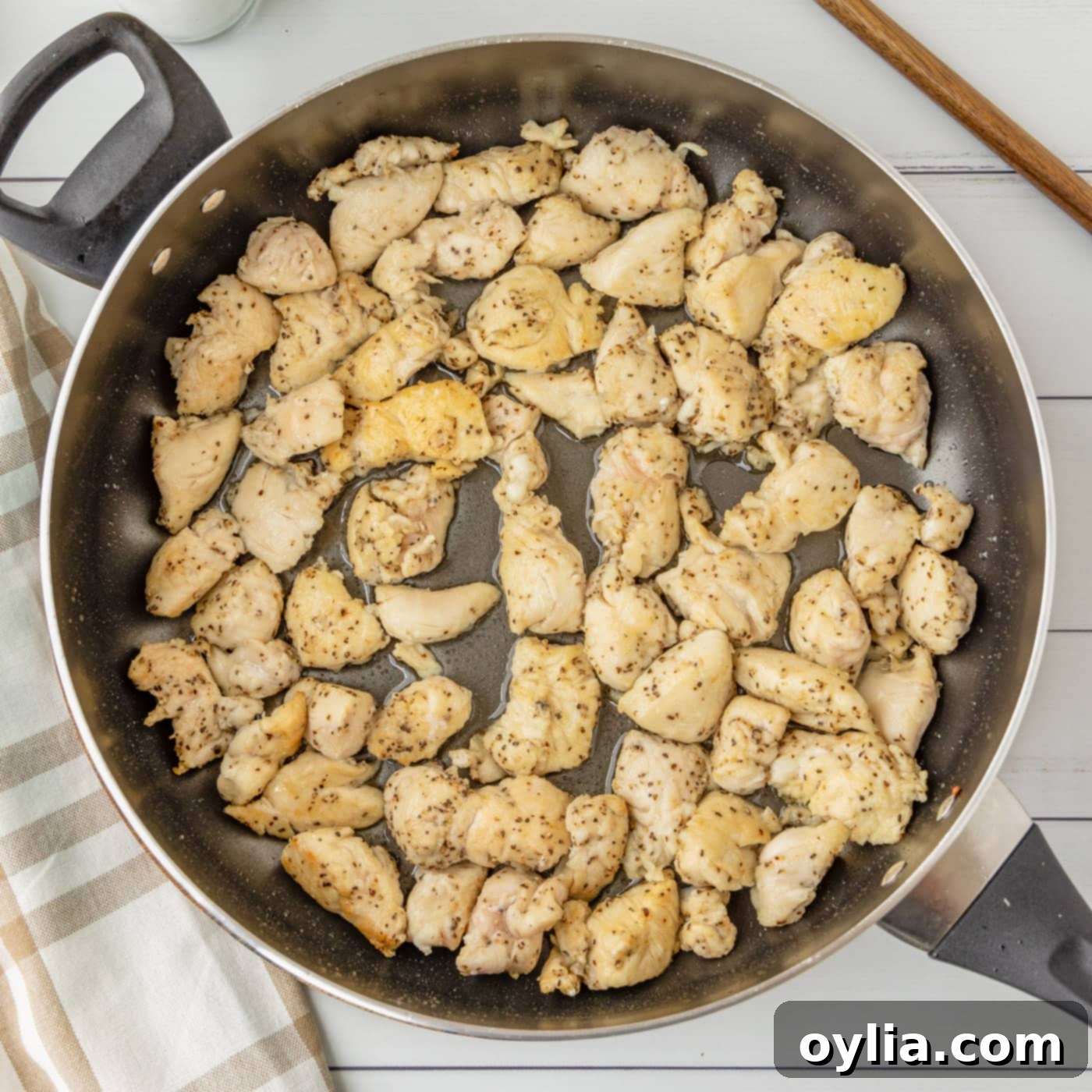 chicken cooking in a skillet