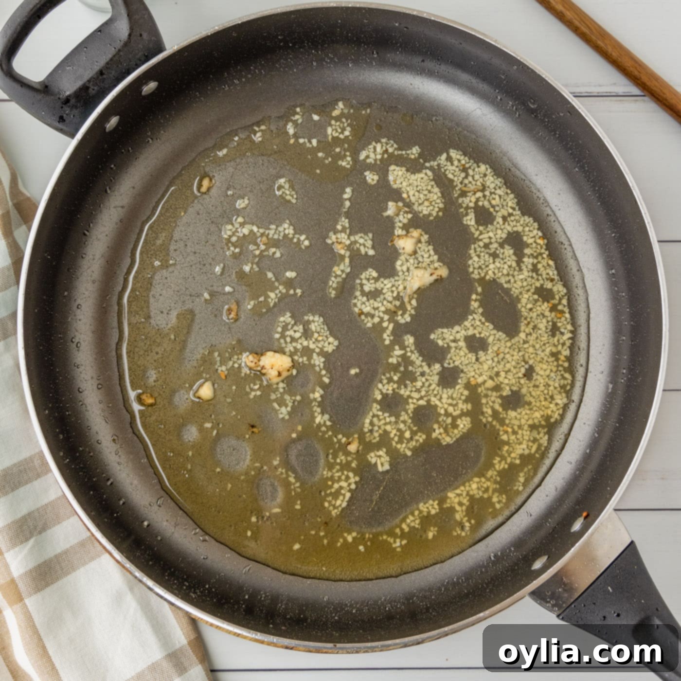garlic and bourbon in a skillet