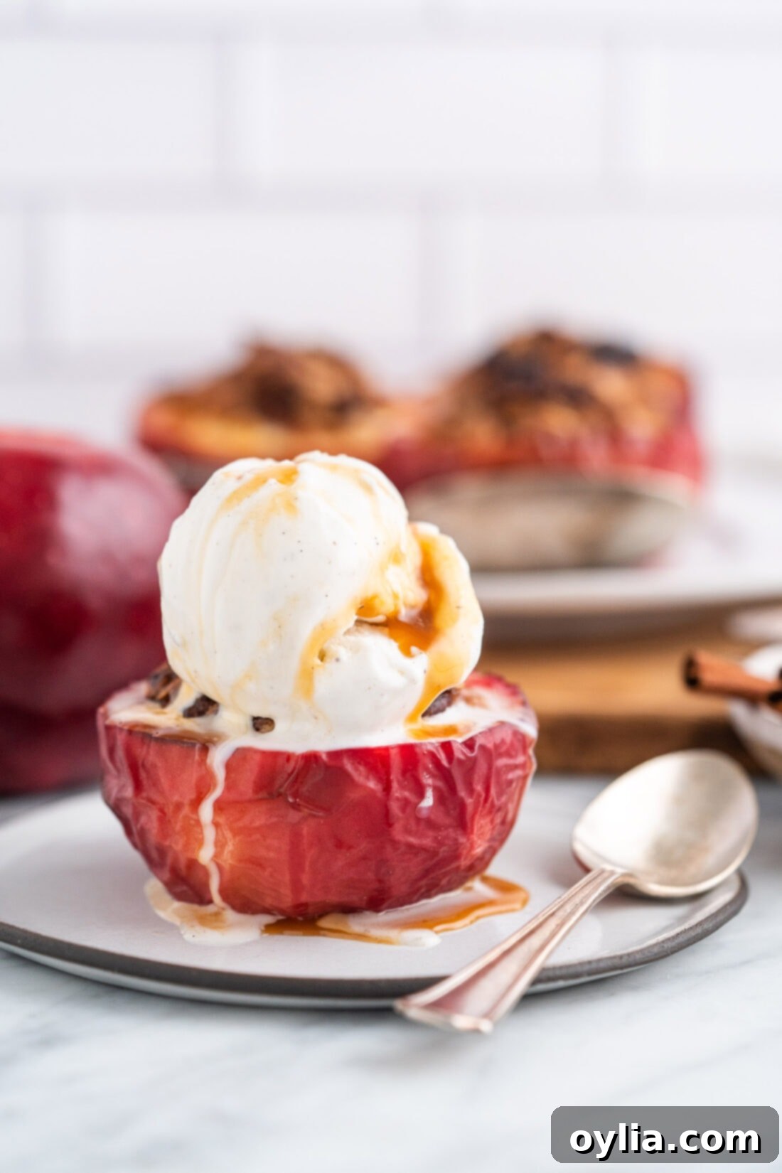 Air Fryer Apple Bliss 12 Air Fryer Baked Apple with vanilla ice cream and caramel drizzle on top