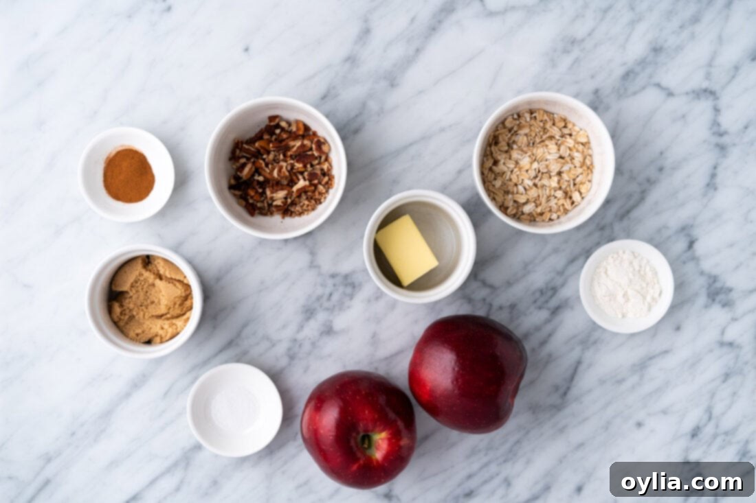 Air Fryer Apple Bliss 4 Ingredients laid out on a cutting board to make Air Fryer Baked Apples