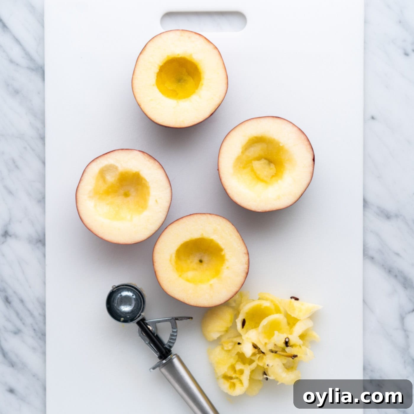 Cored apple halves using a melon baller