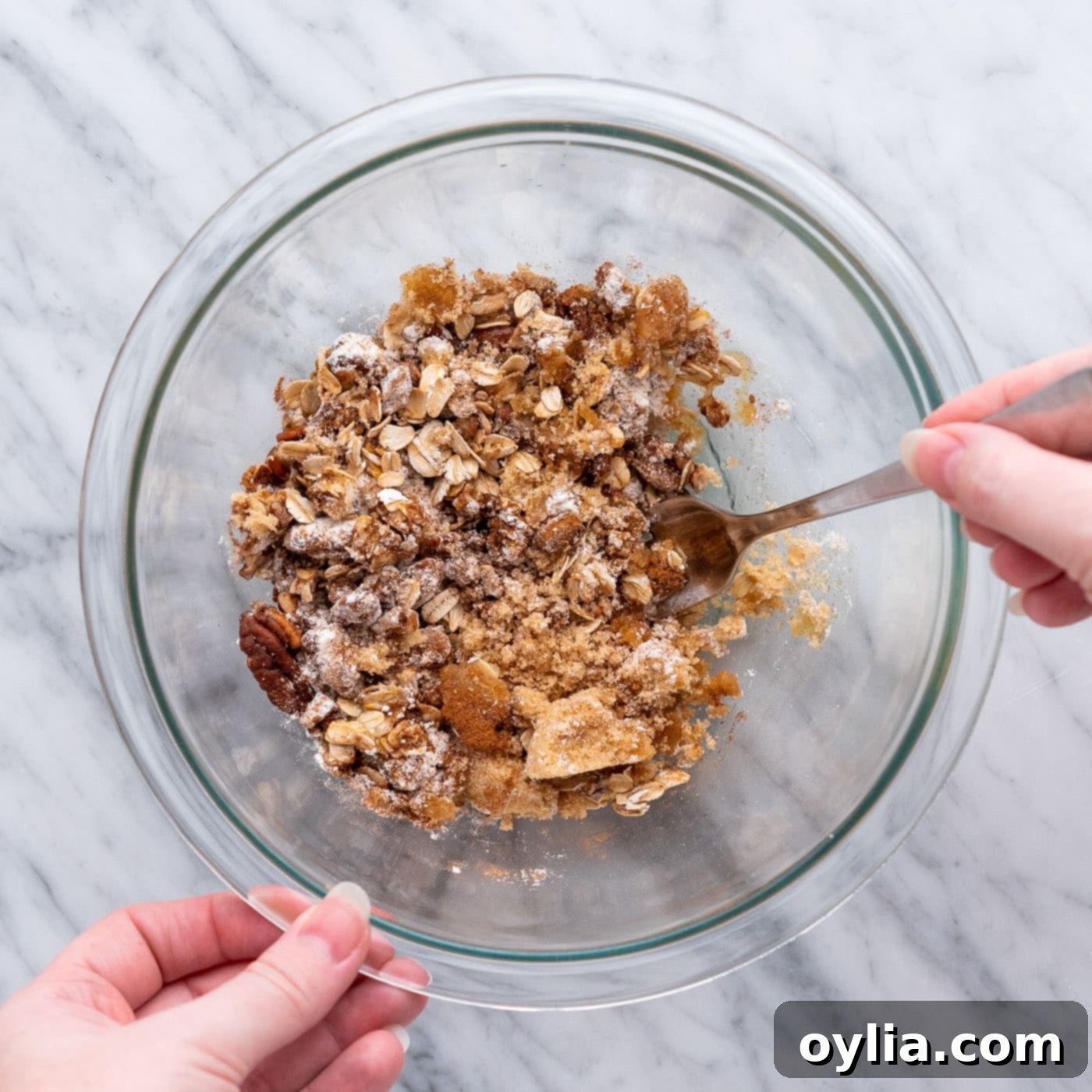 Mixing baked apple filling in a bowl