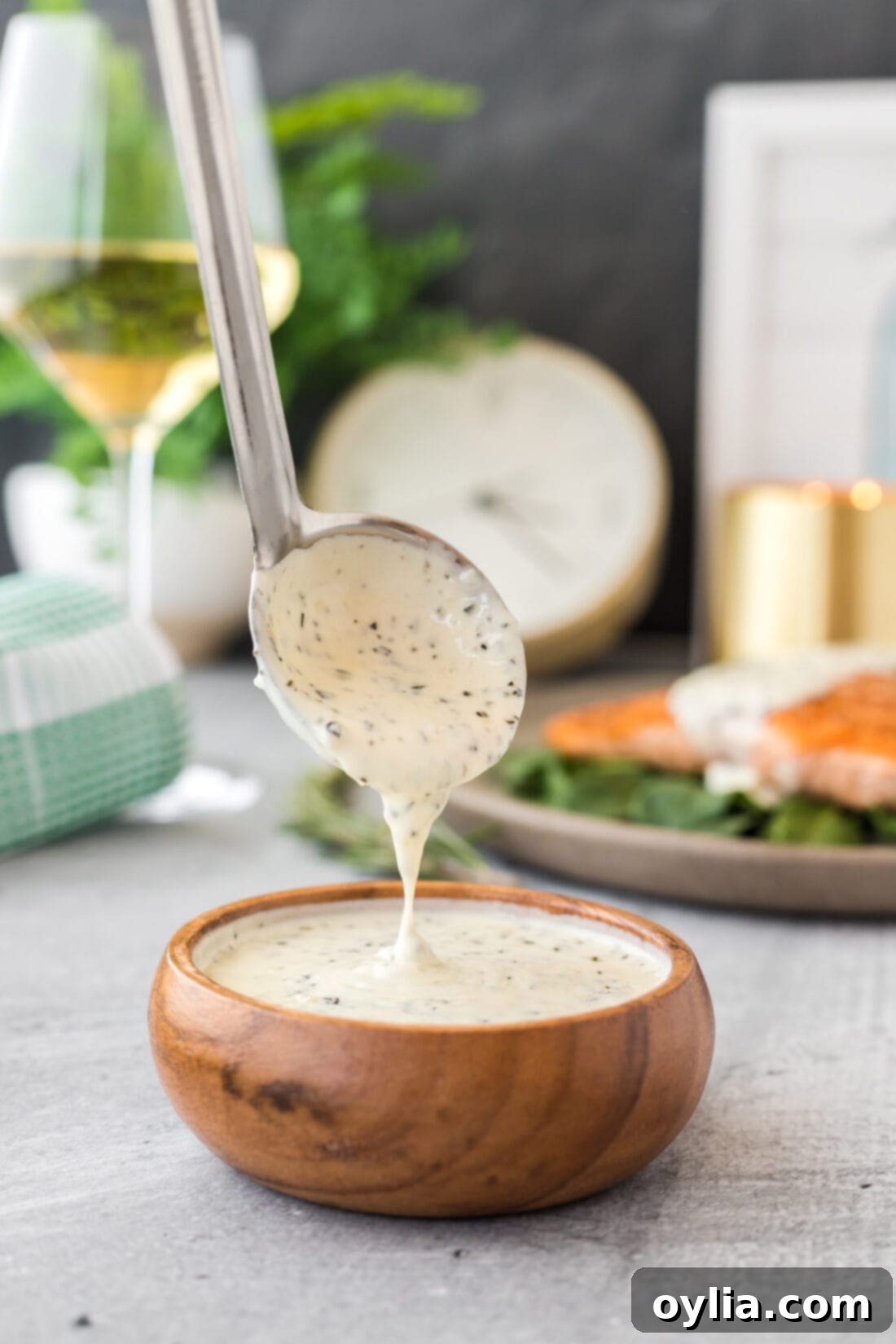 Creamy Rosemary Sauce 2 Ladle of Rosemary Cream Sauce showcasing its creamy texture