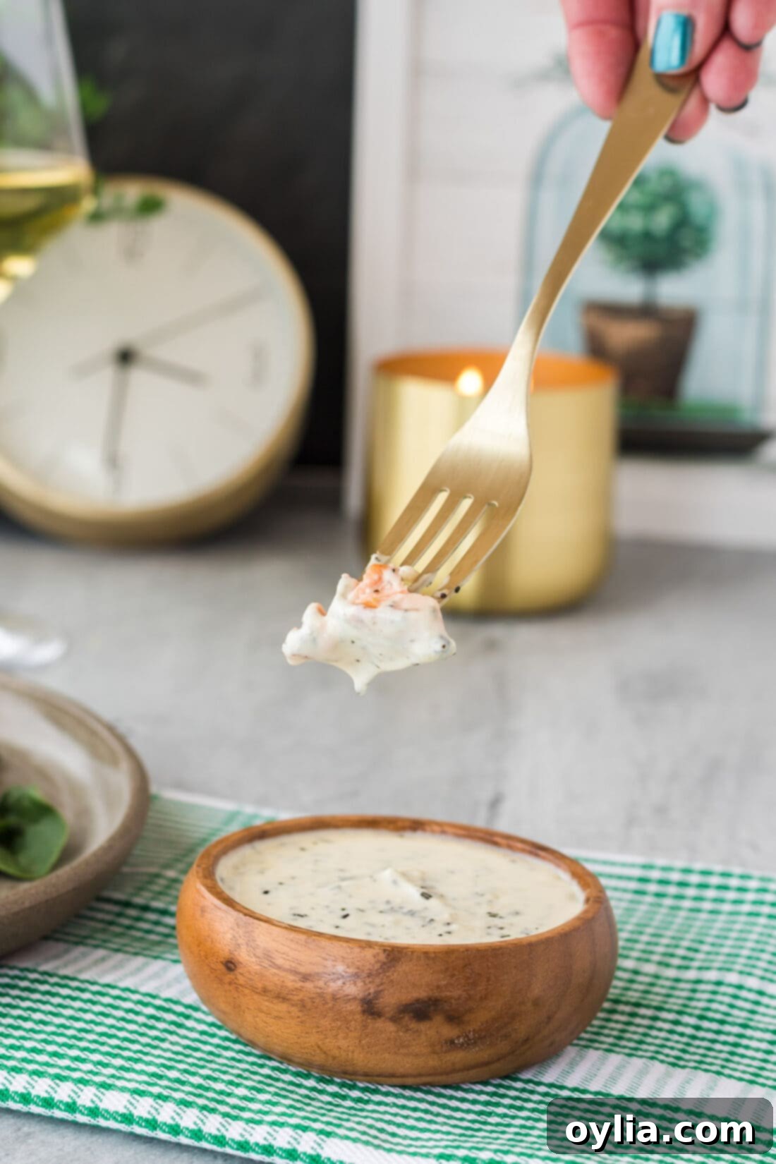Creamy Rosemary Sauce 6 Piece of salmon dipped into a bowl of Rosemary Cream Sauce