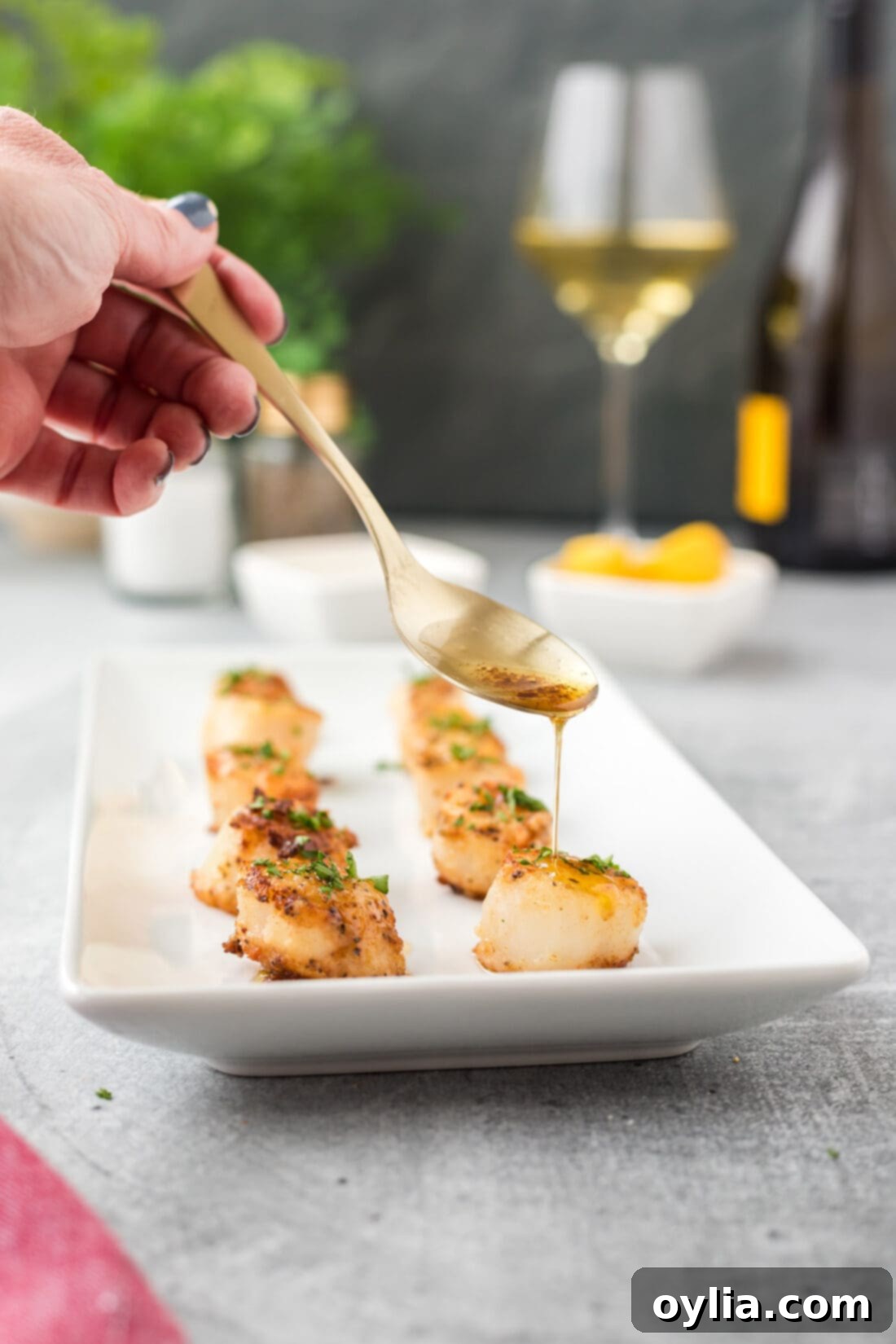 drizzling butter on Pan Seared Scallops