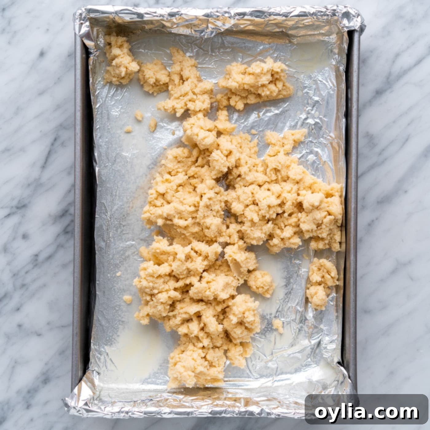 shortbread crust on top of a baking pan