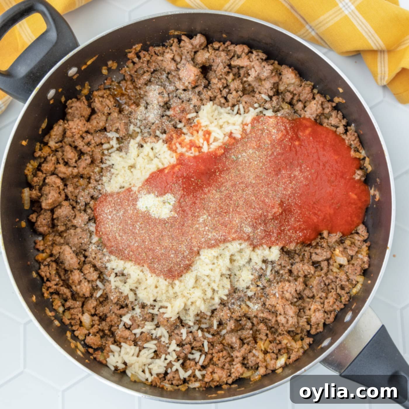 beef mixture with tomato sauce in a skillet