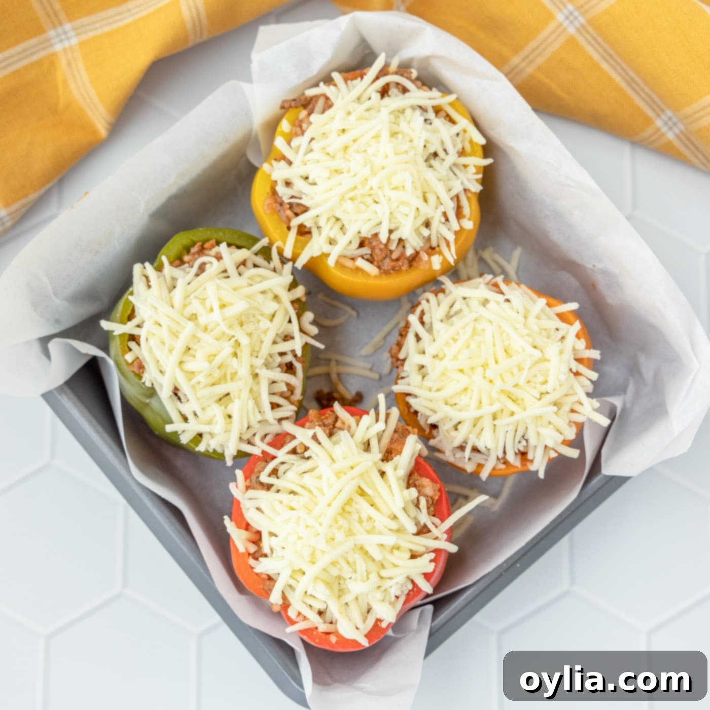 stuffed peppers with cheese in a baking dish