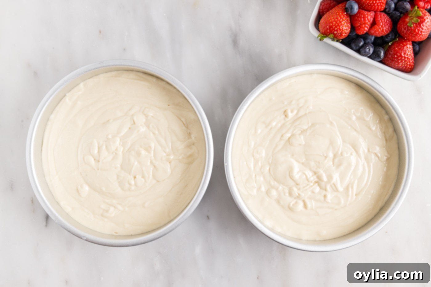 cake batter in round cake pans