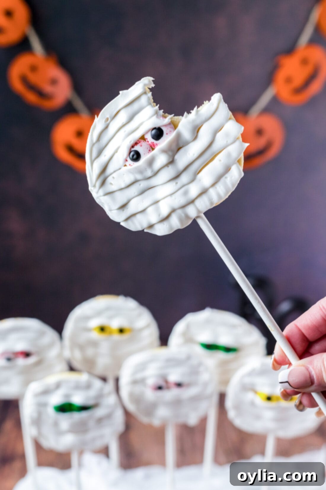 Spooky Bandage Bites 12 A Mummy Cookie with a bite taken out, showing the soft interior